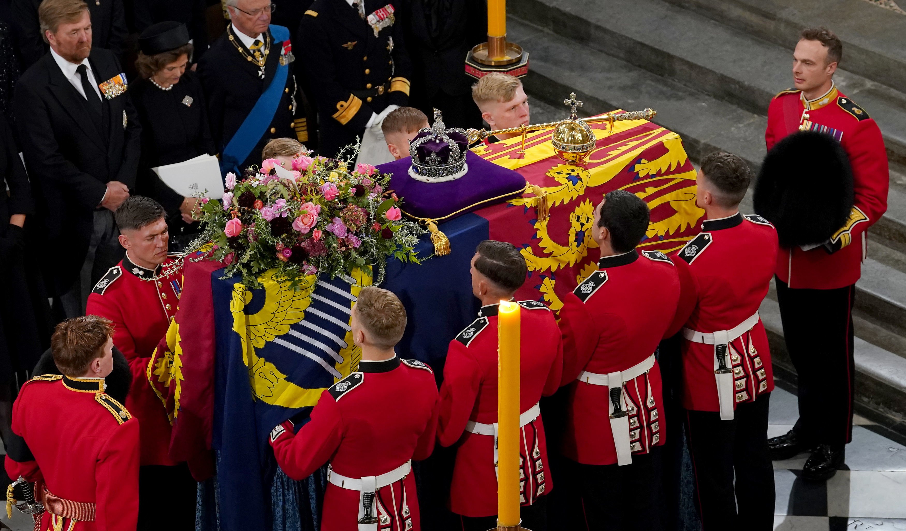 The bearer party with the coffin of Queen Elizabeth II as it is taken from Westminster Abbey on September 19, 2022, in London, England. | Source: Getty Images