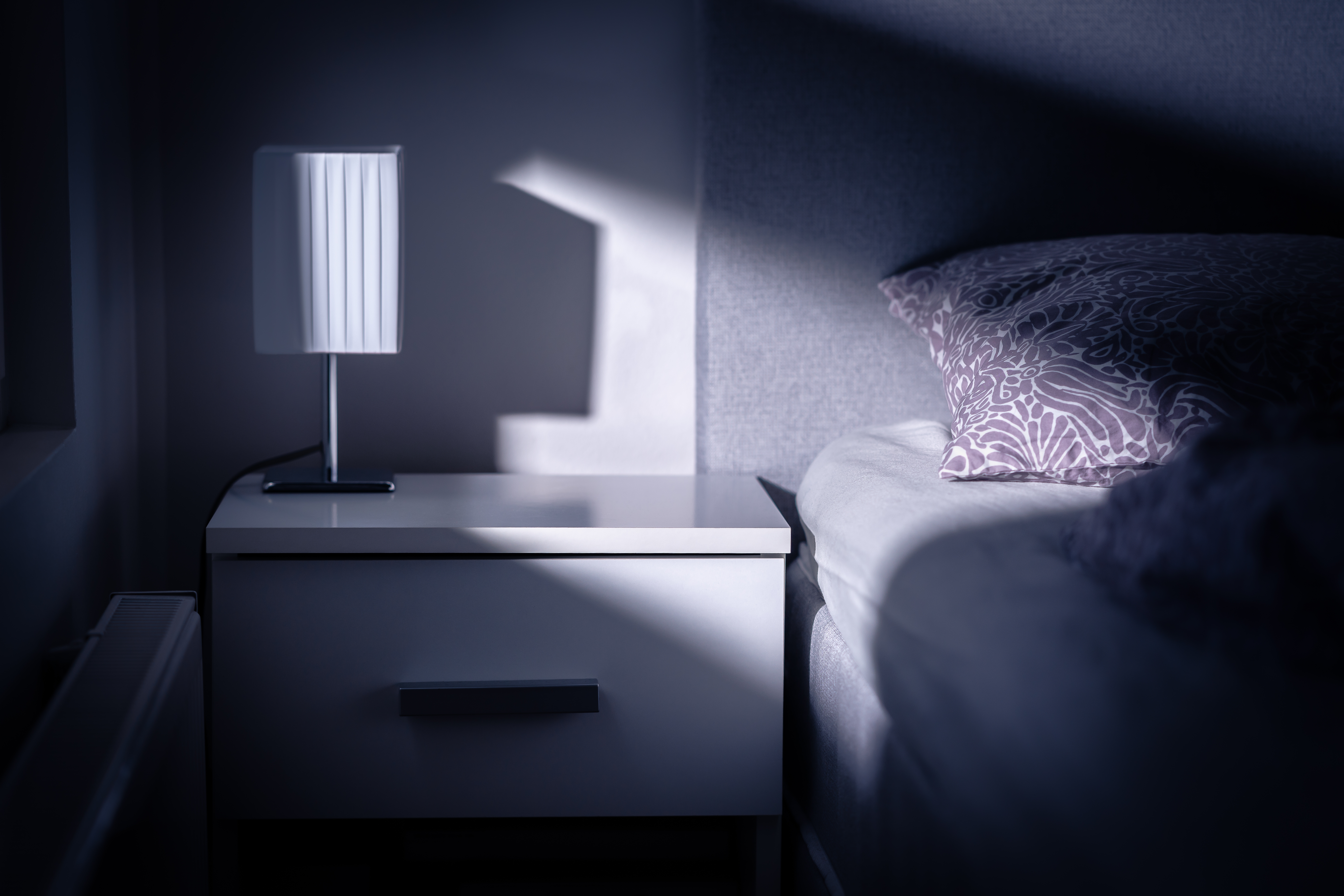 Moonlight in bedroom at night | Source: Shutterstock