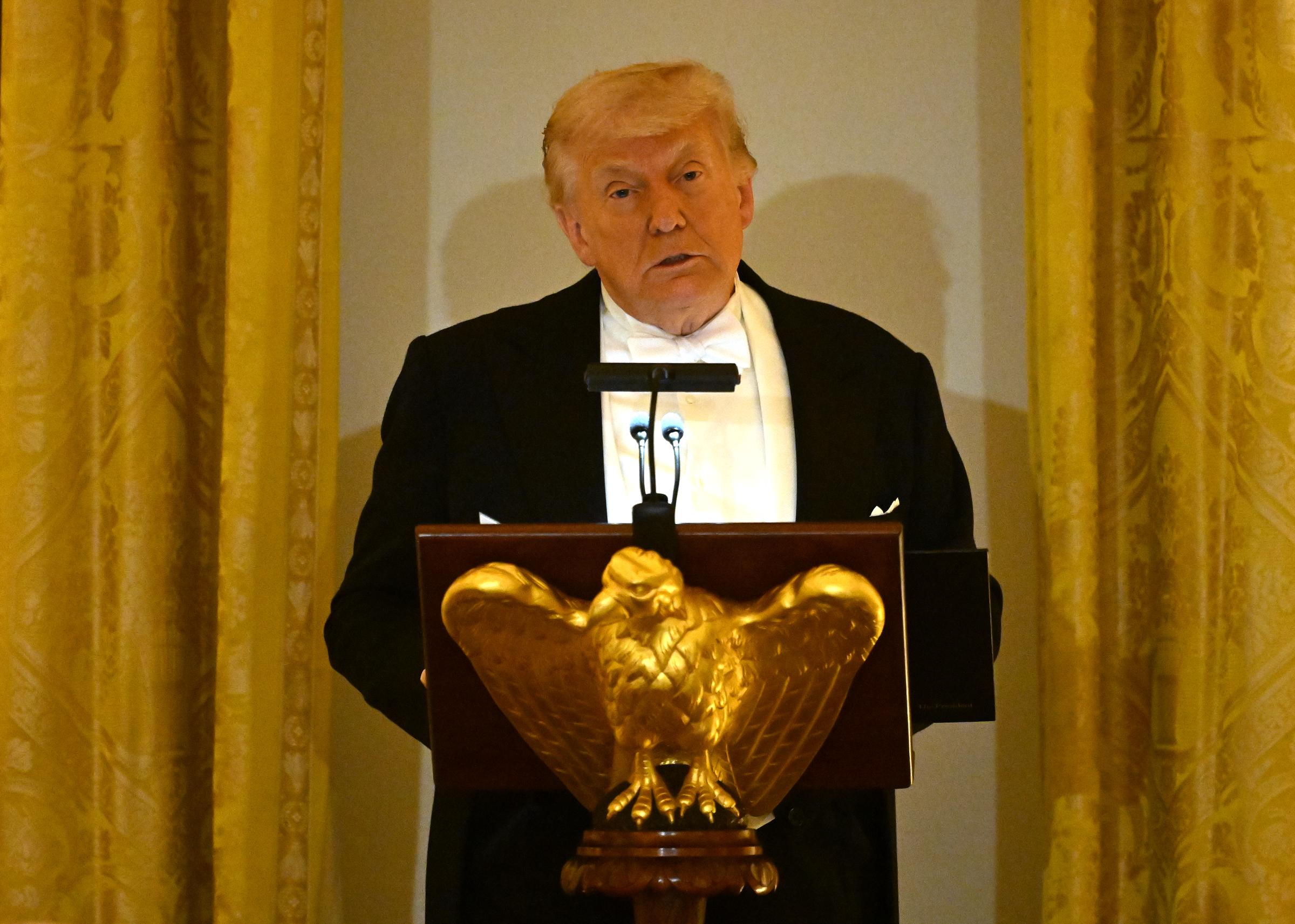 Donald Trump delivers remarks during a State Dinner in the White House East Room, April 28, 2026. | Source: Getty Images