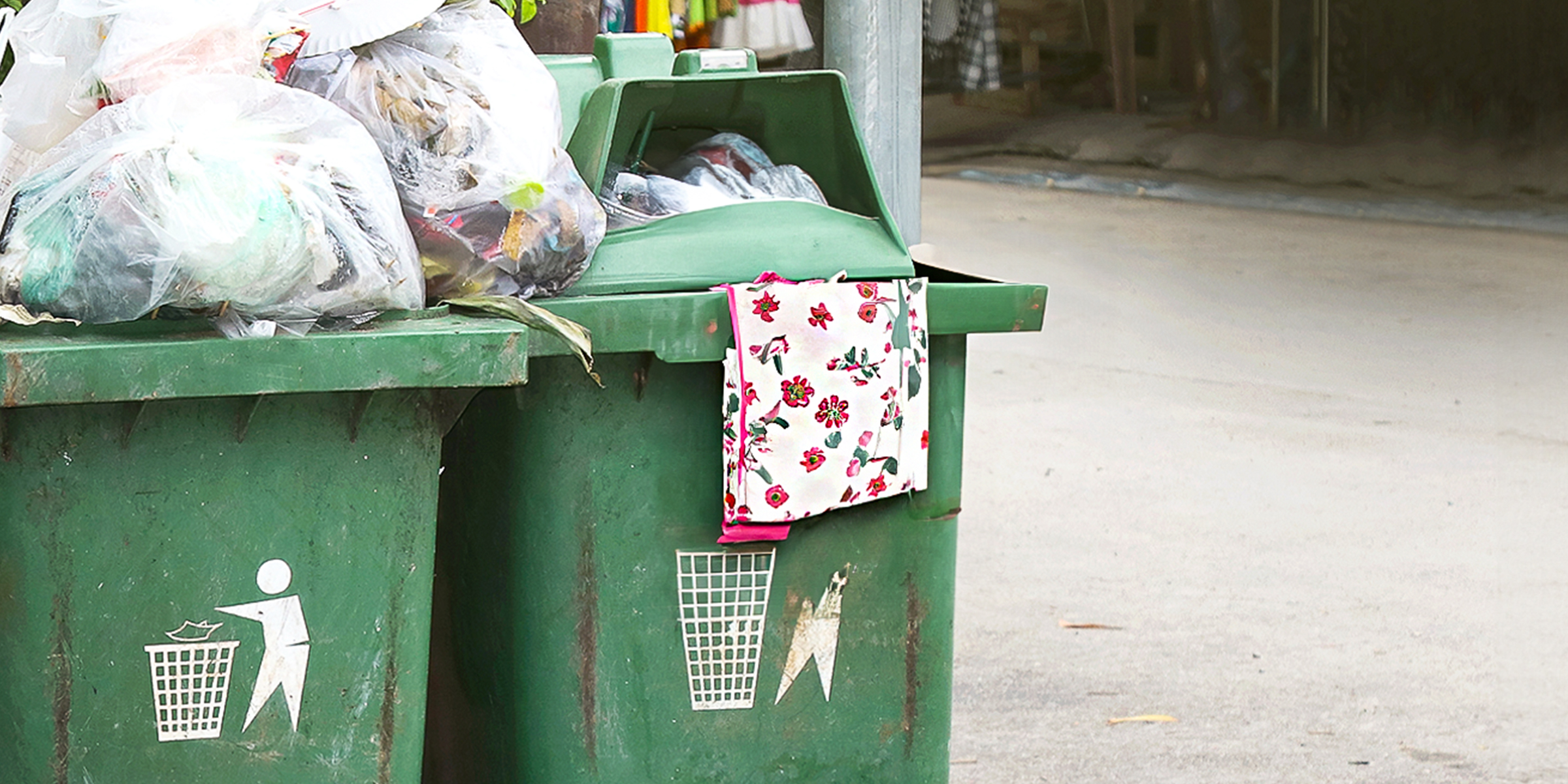 A floral apron in a garbage bin | Source: Shutterstock
