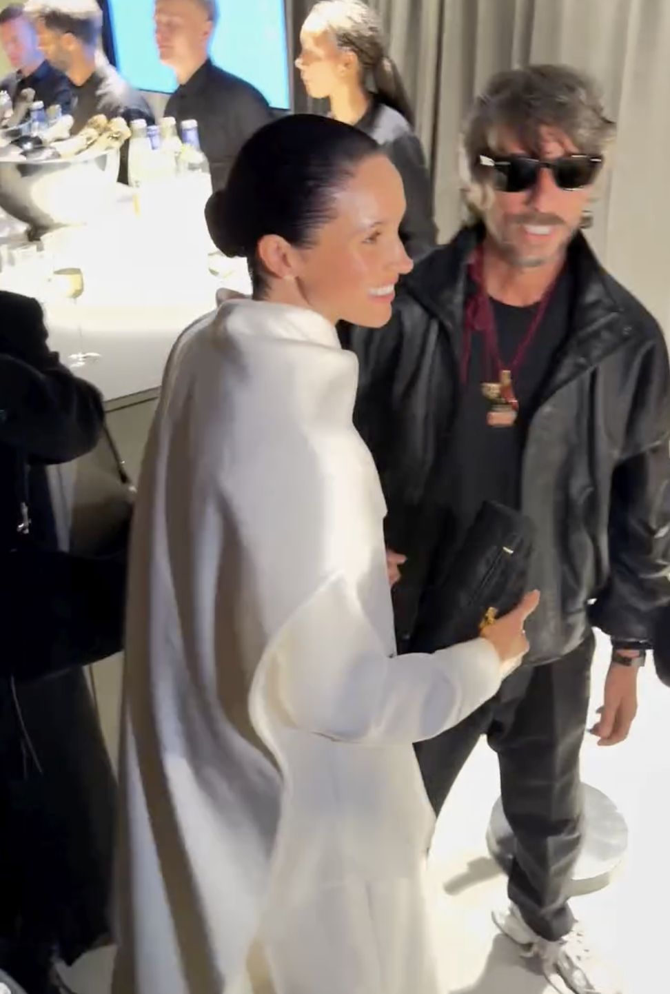 Meghan Markle shares a heartfelt hug with Pierpaolo Piccioli after his first collection for Balenciaga at Paris Fashion Week. The Duchess of Sussex warmly congratulates the designer, celebrating his debut and their enduring creative partnership.