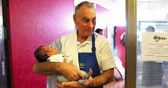 Jim O'Connor pictured while holding a baby at the hospital. | Source: facebook.com/ktla5