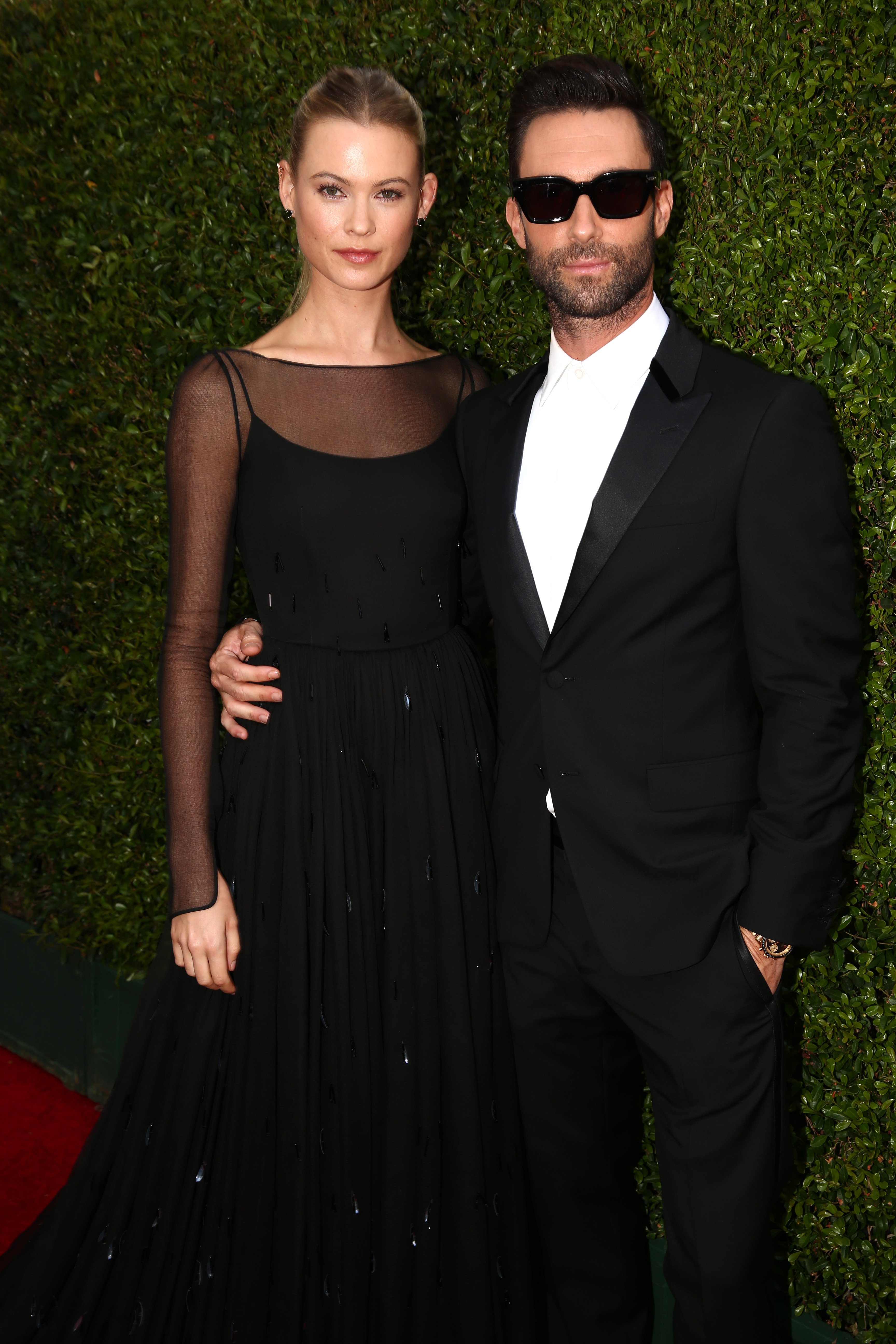 Model Behati Prinsloo and recording artist Adam Levine arrive to the 66th Annual Primetime Emmy Awards held at the Nokia Theater on August 25, 2014 | Source: Getty Images