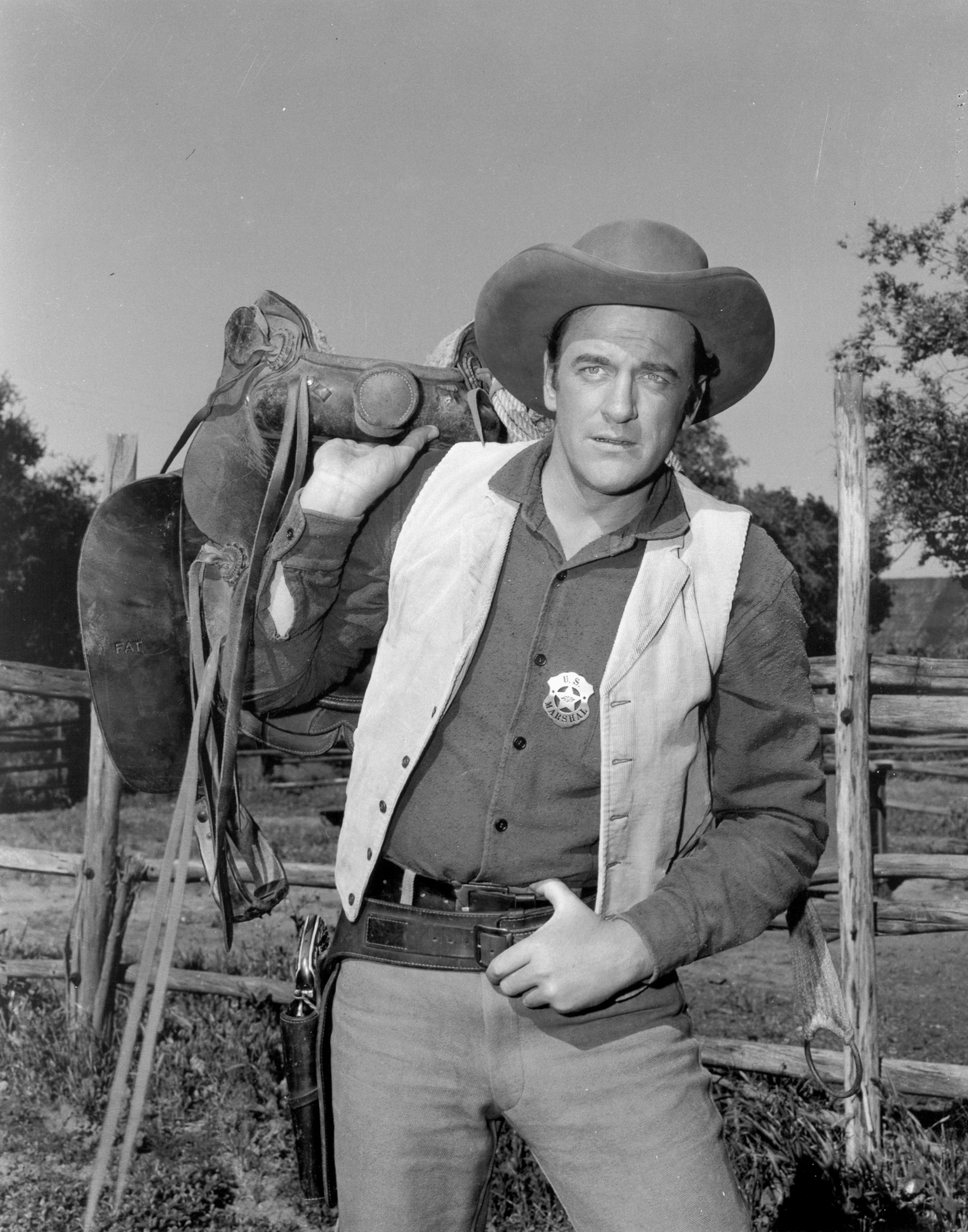 James Arness (as US Marshal Matt Dillon) posing in costume from the CBS western 'Gunsmoke,' on May 15, 1957. | Source: Getty Images