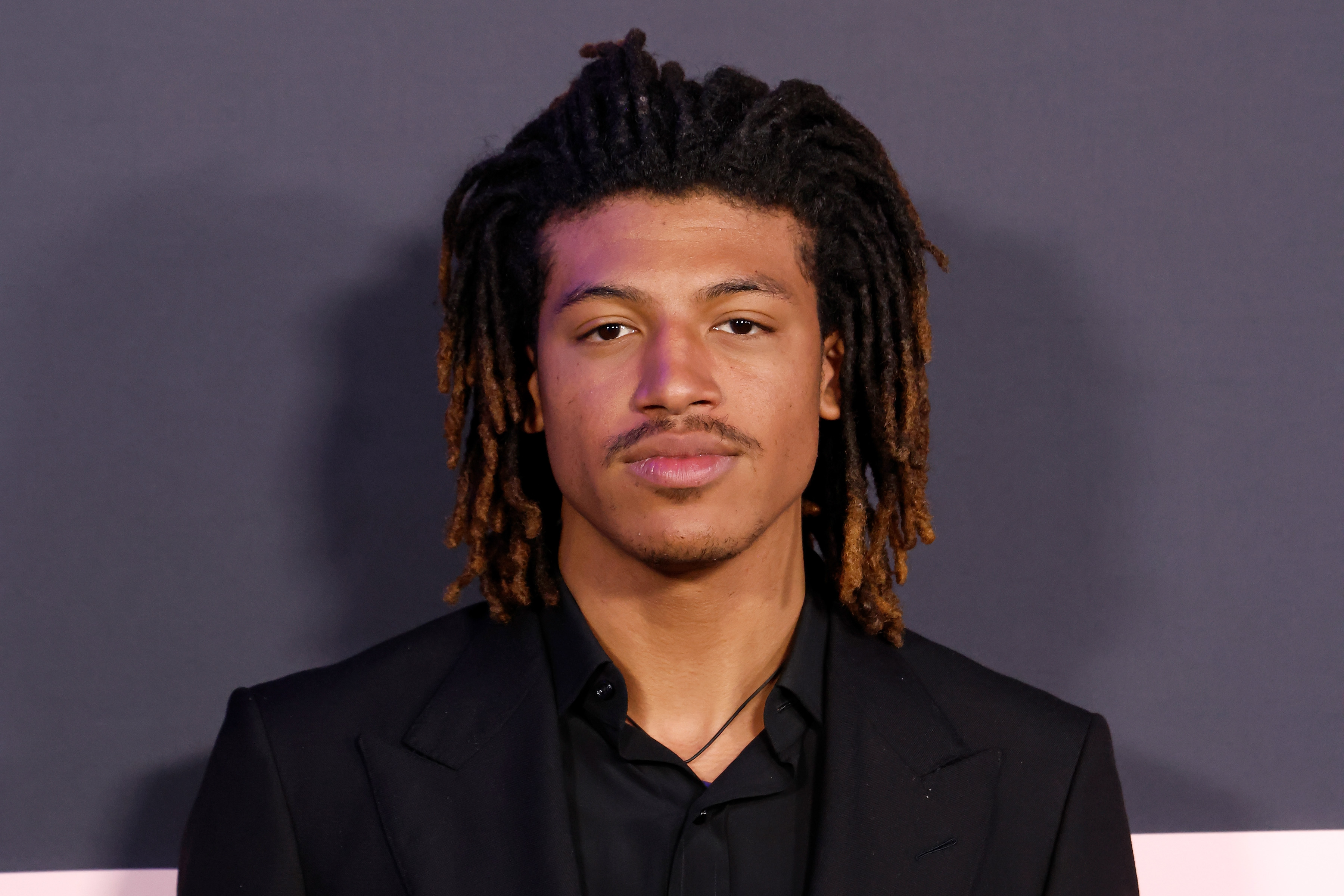 At the premiere of "The Drama" in New York City, Henry Samuel’s transformation comes into sharp focus. His defined features, confident gaze, and effortlessly tailored look mark a clear shift from childhood familiarity to a composed, self-assured presence stepping fully into his own identity.