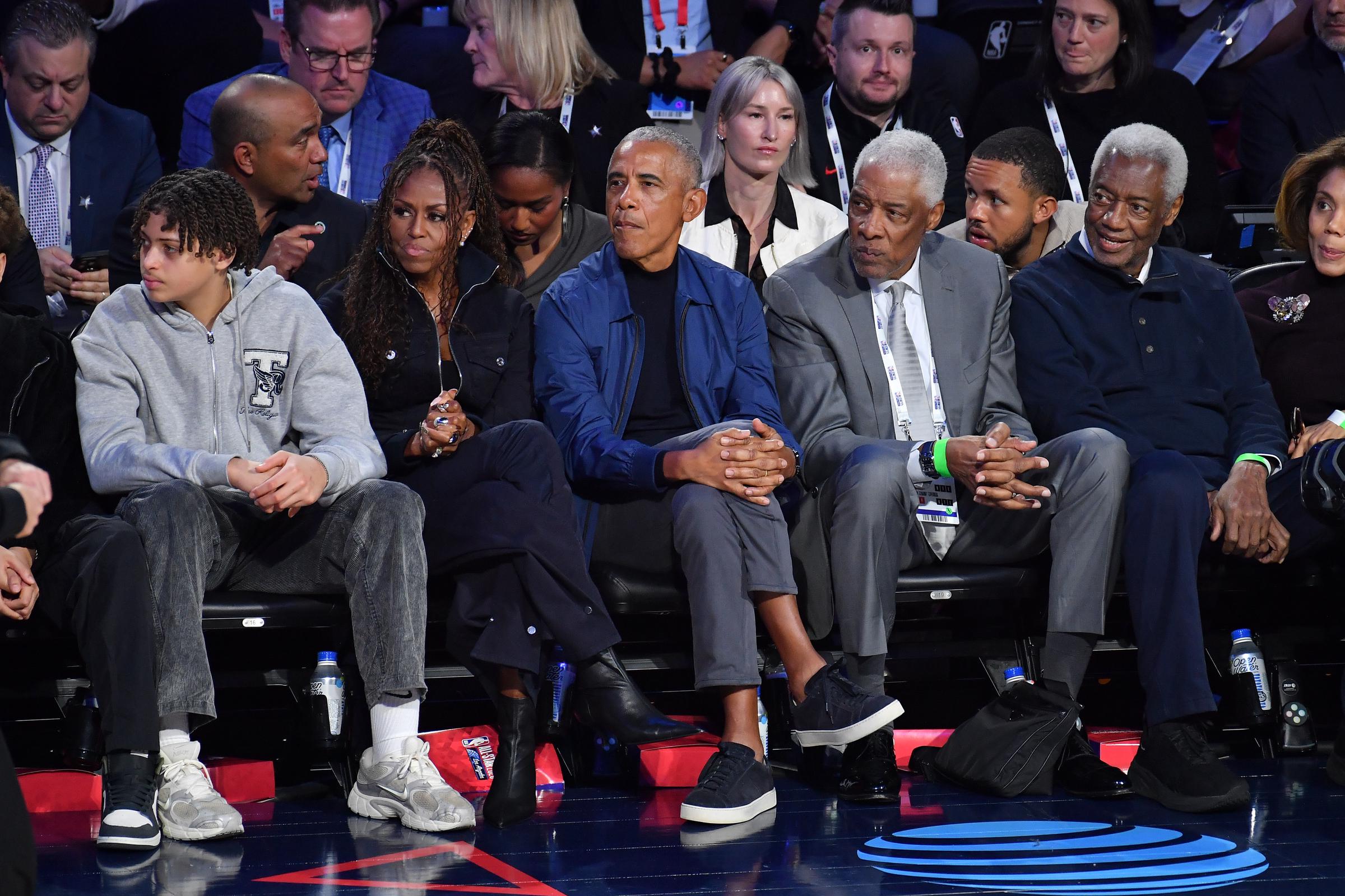 Michelle and Barack Obama watching the basketball match among others, including Sasha Obama. | Source: Getty Images