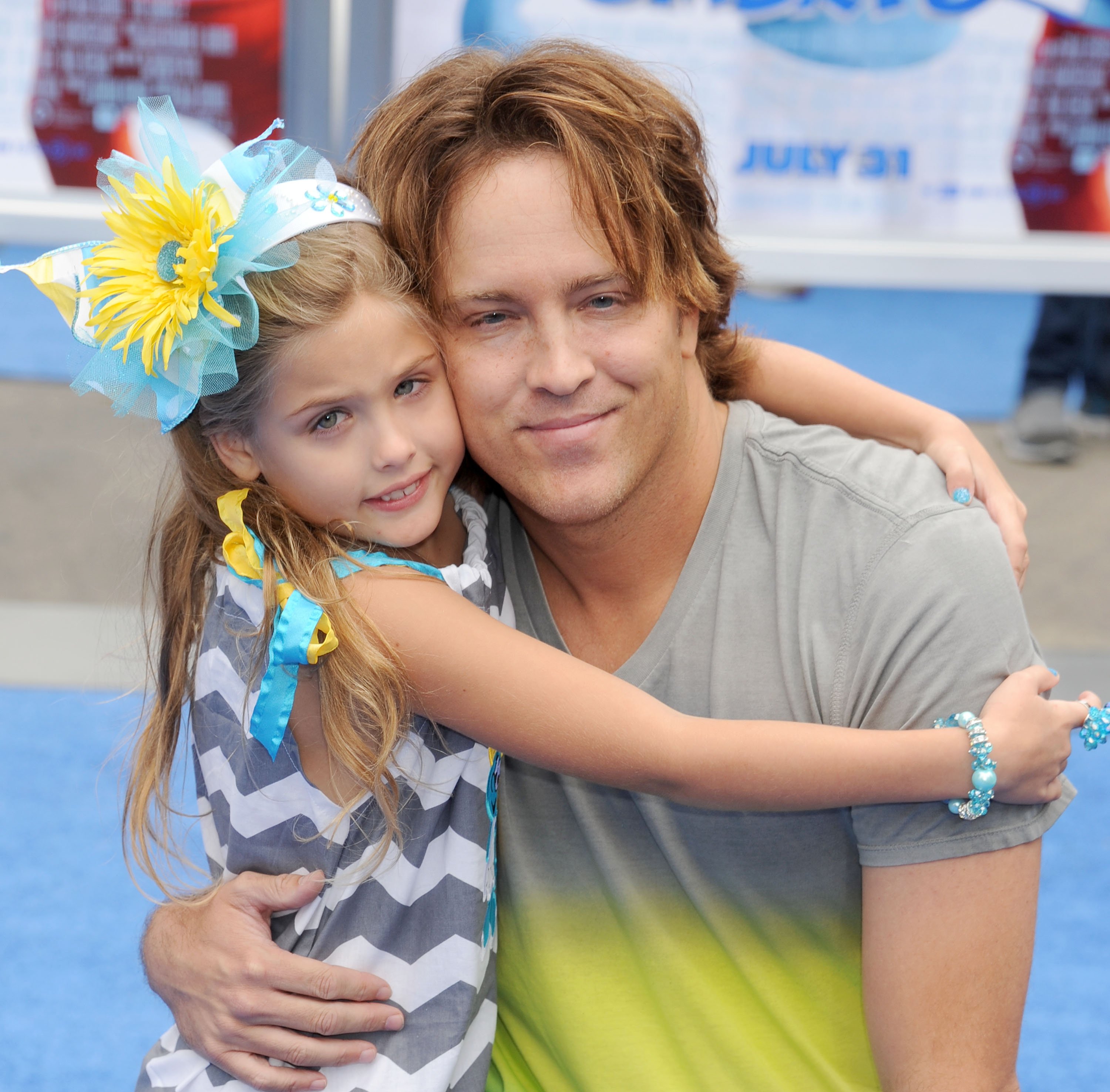 Larry Birkhead and his daughter Dannielynn Birkhead at the Los Angeles "Smurfs 2" premiere on July 28, 2013, in Westwood, California | Source: Getty Images