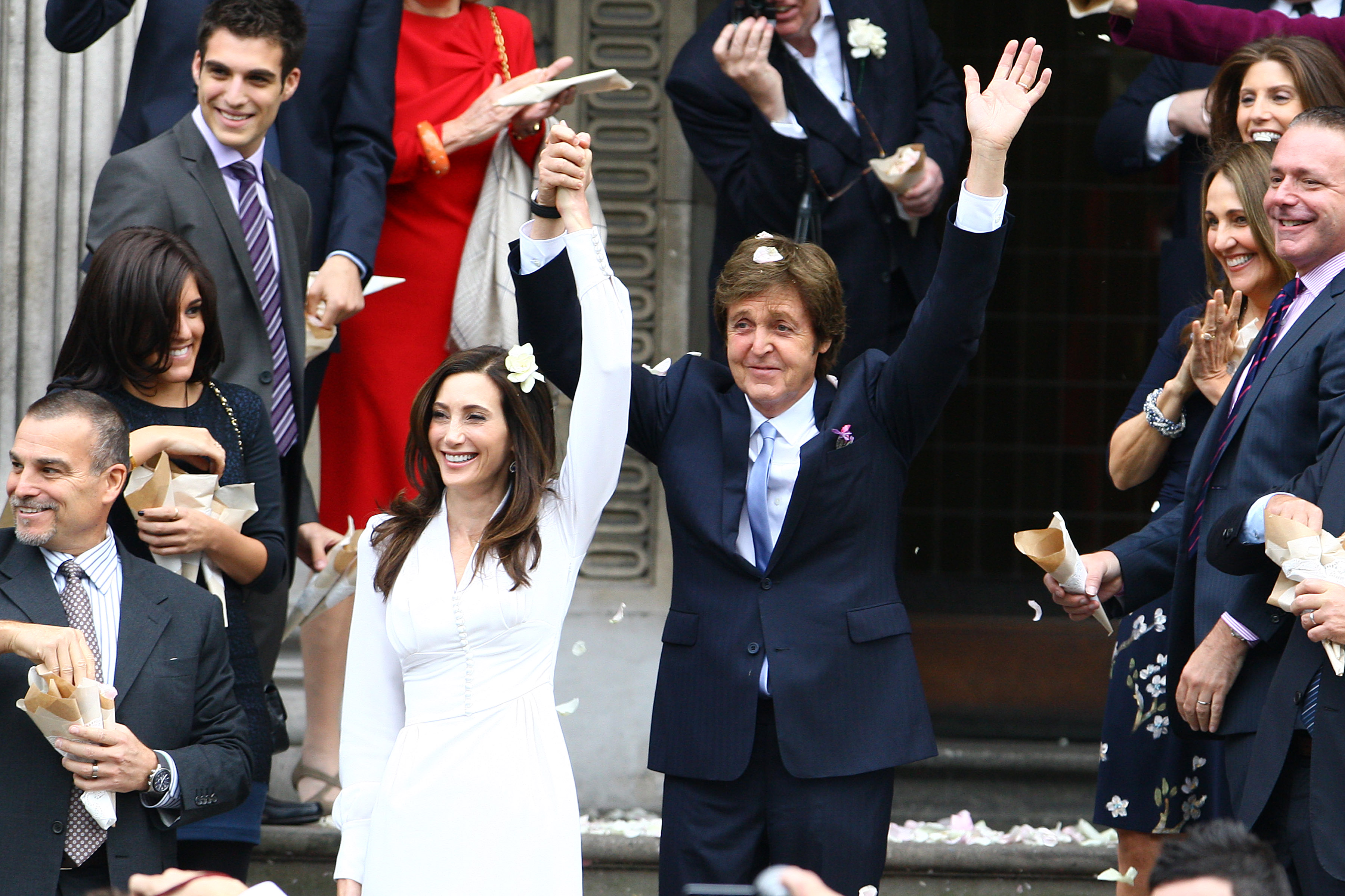 Paul McCartney and Nancy Shevell leaving their wedding ceremony at Marylebone Registry Office in central London, England on October 9, 2011 | Source: Getty Images