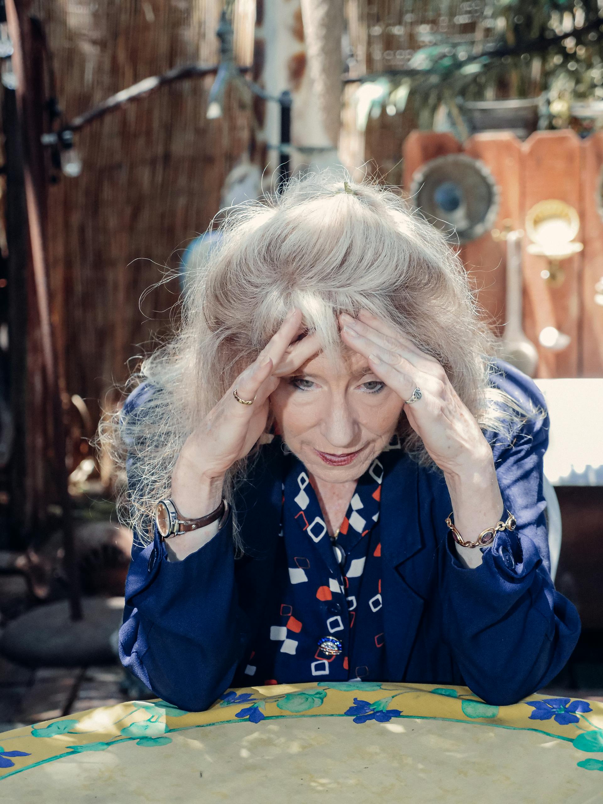 A mature woman seated in a restaurant | Source: Pexels