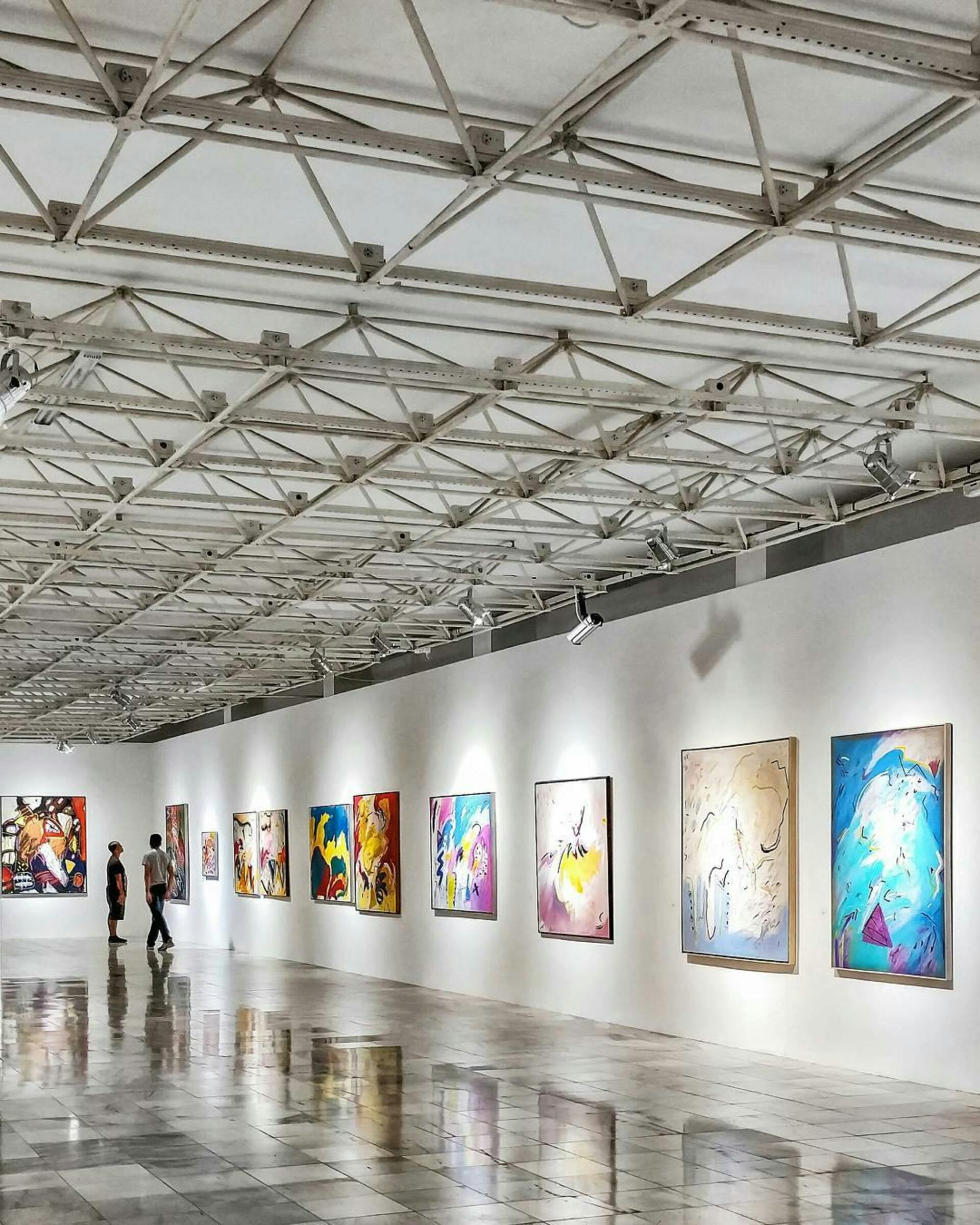Colorful art hanging in a gallery | Source: Pexels