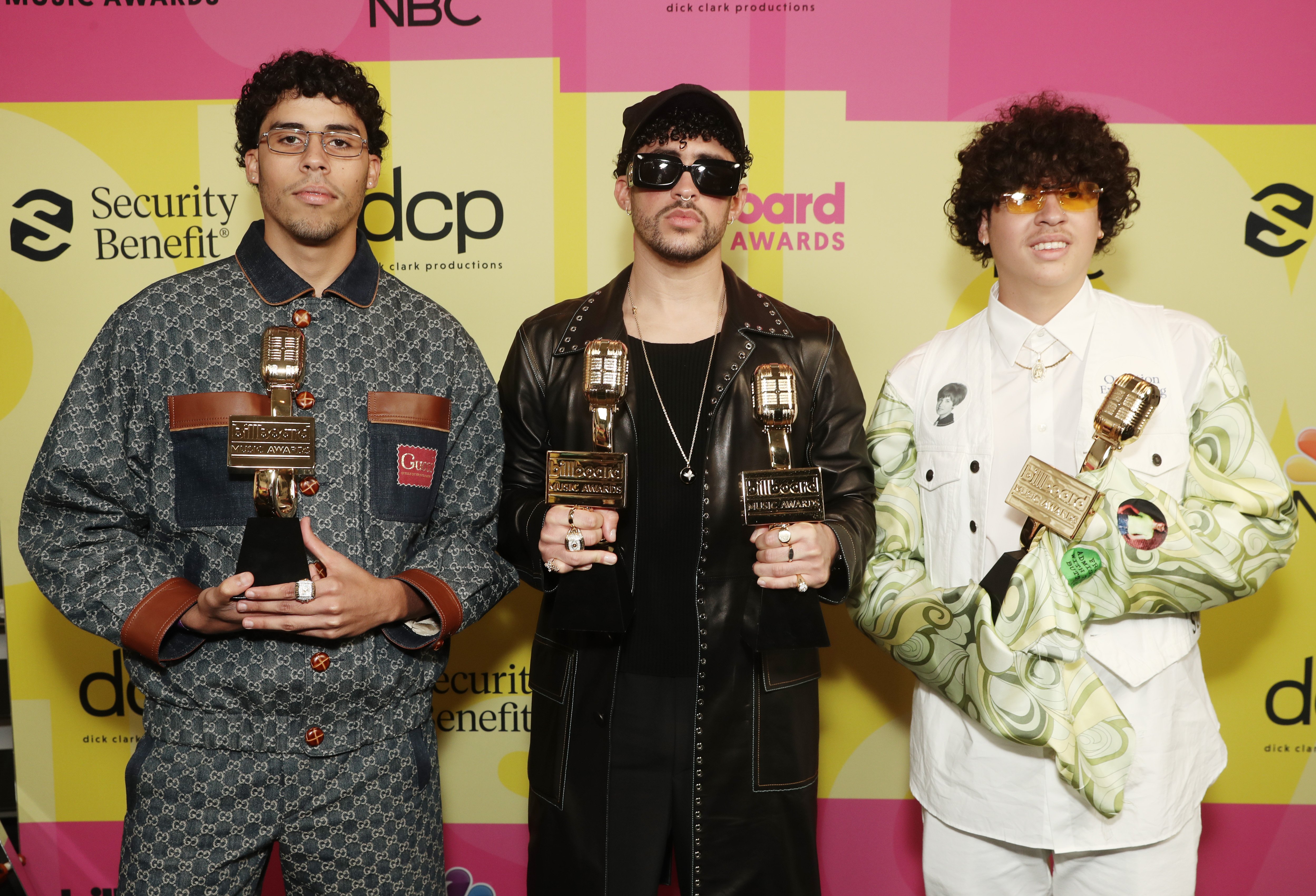 Bad Bunny (C), backstage with his brothers Bernie Martinez (L) and Bysael Martinez (R) at the 2021 Billboard Music Awards held at the Microsoft Theater in LA, California, on May 23, 2021. | Source: Getty Images