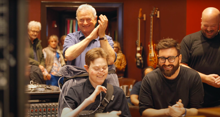 McCanna Anthony "Mac" Sinise, Gary Sinise and other people at a music studio posted on February 22, 2024 | Source: YouTube/Mac Sinise