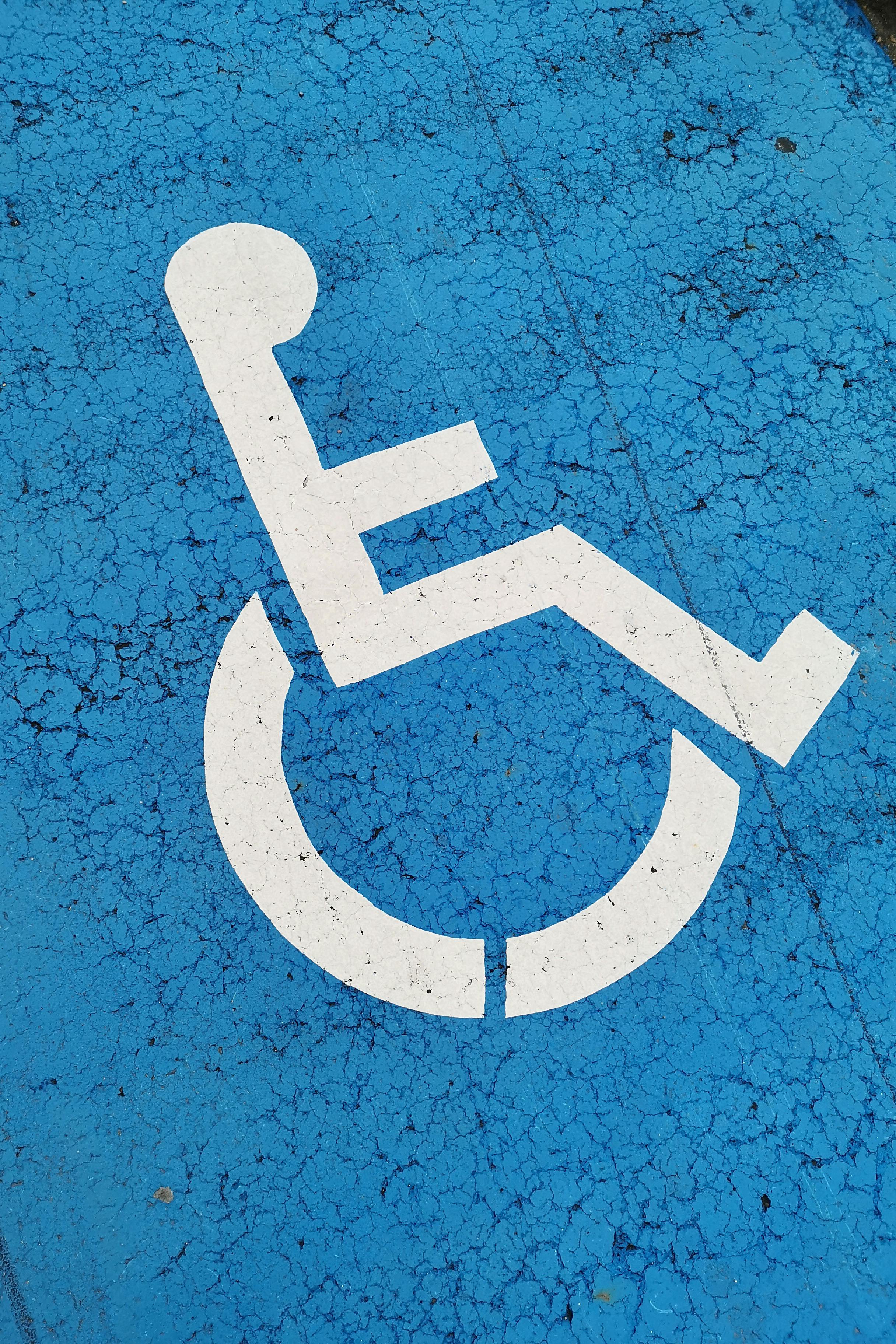 Ground-marking signifying a disability-friendly parking bay | Source: Pexels