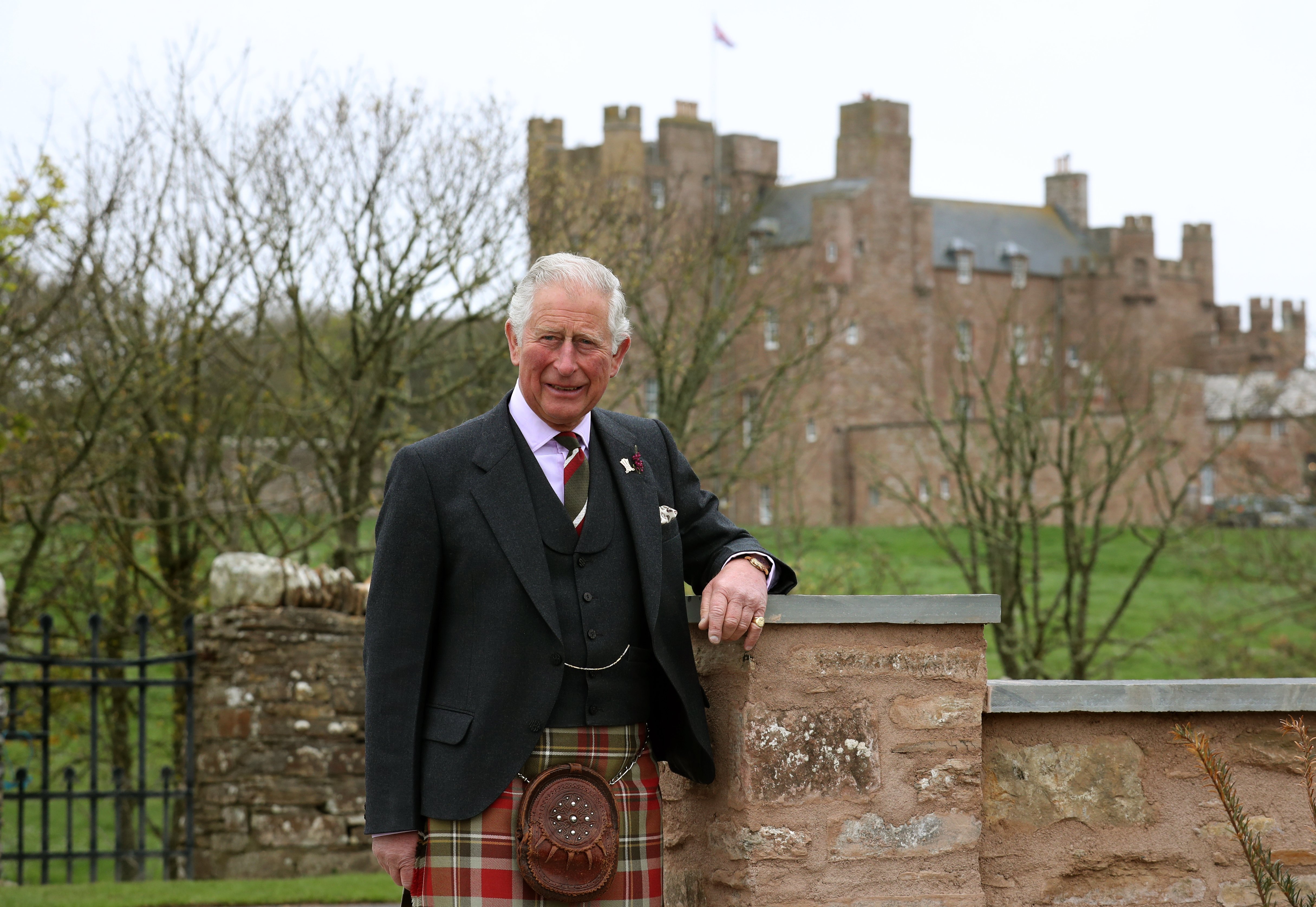 Prince Charles poses for a photograph in front of the Castle of Mey after he officially opened the Granary Accommodation on May 1, 2019. | Source: Getty Images