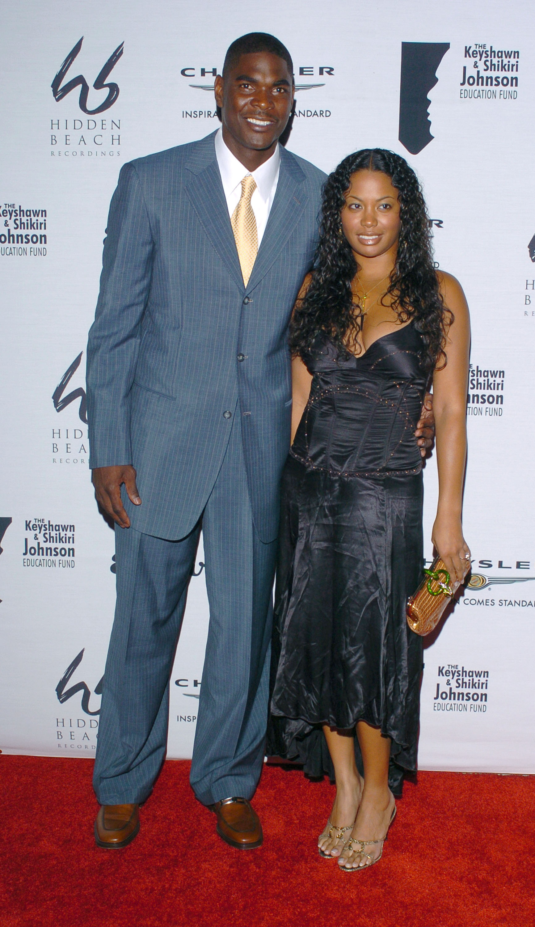 Keyshawn Johnson and Shikiri Hightower during Benefit for The Keyshawn & Shikiri Johnson Education Fund at Esquire House on October 4, 2004 in Beverly Hills, California. | Sources: Getty Images