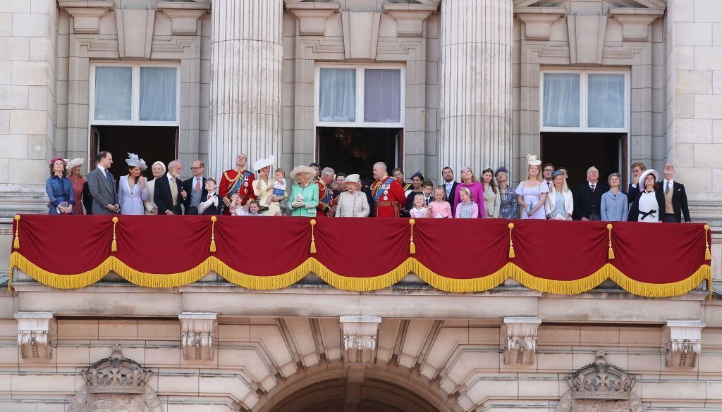 Queen Elizabeth II, Catherine, Duchess of Cambridge and Prince William, Duke of Cambridge, Meghan, Duchess of Sussex, Prince Harry, Duke of Sussex alongside other members of the royal family on the balcony of Buckingham Palace during Trooping The Colour. | Photo: Getty Images