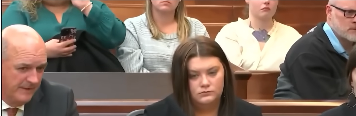 The defendant resumes a straight face after the other charges have been read against her, as seen from a video post dated December 5, 2025. | Source: YouTube/COURTTV