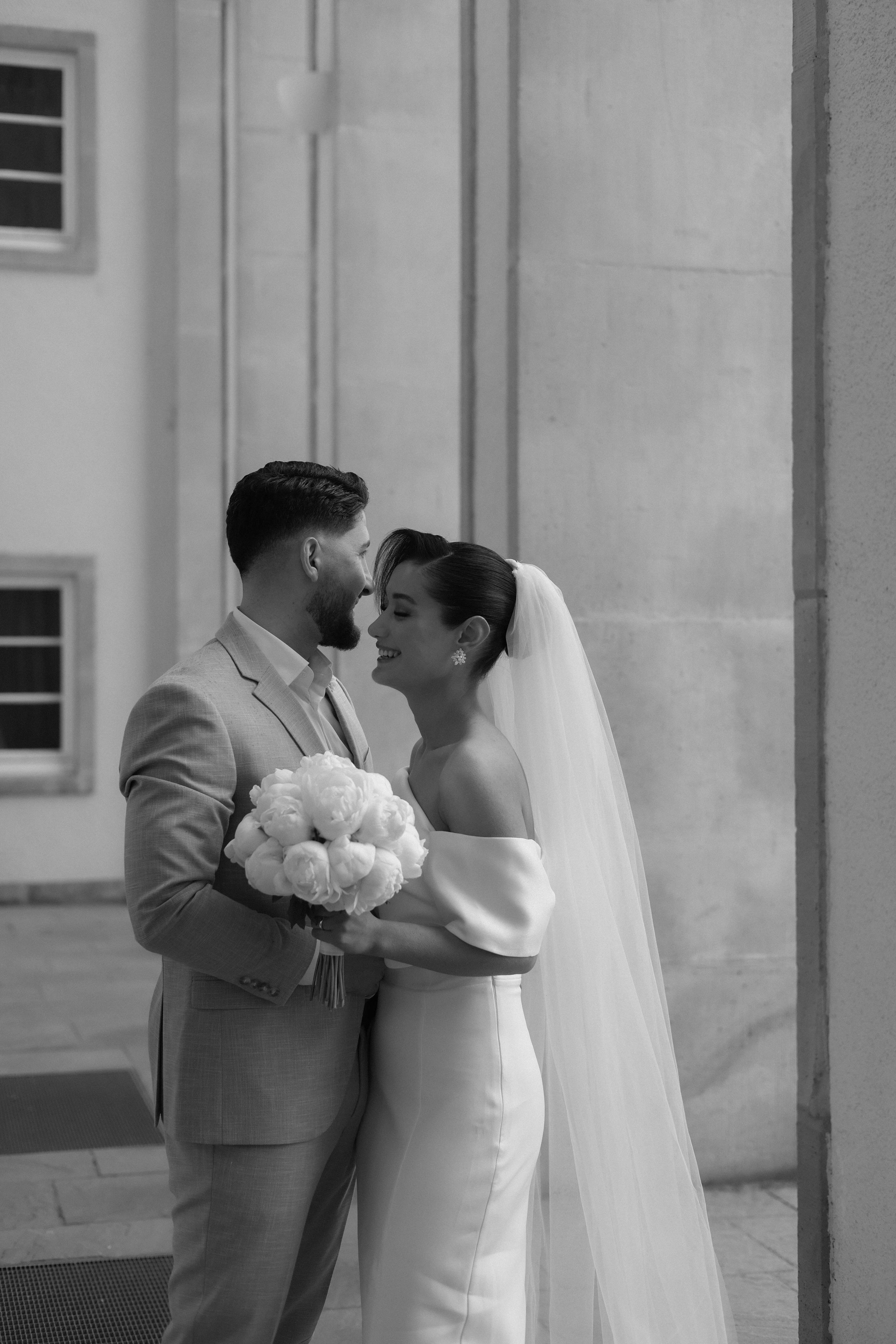 A bridal couple embrace | Source: Pexels