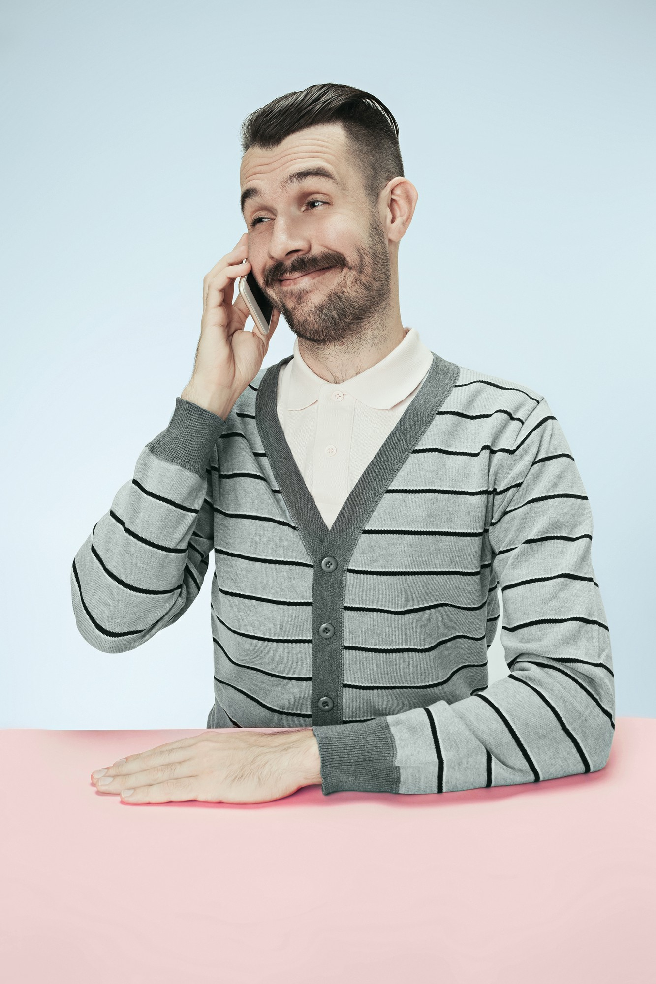 A happy man talking on a phone | Source: Freepik