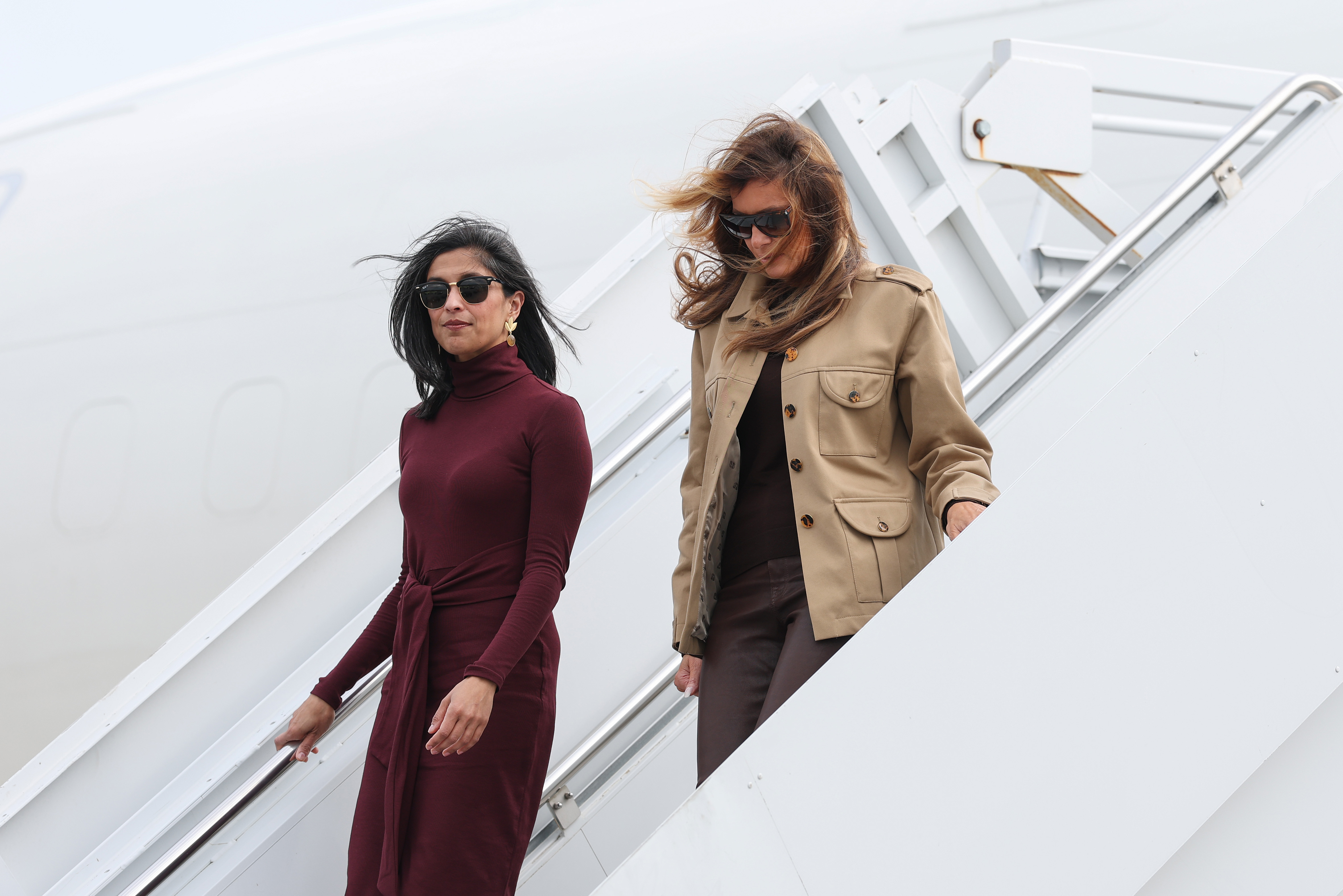 Usha Vance and Melania Trump depart a plane as they arrive at Albert J. Ellis Airport en route to Camp Lejeune in Richlands, North Carolina, on November 19, 2025 | Source: Getty Images