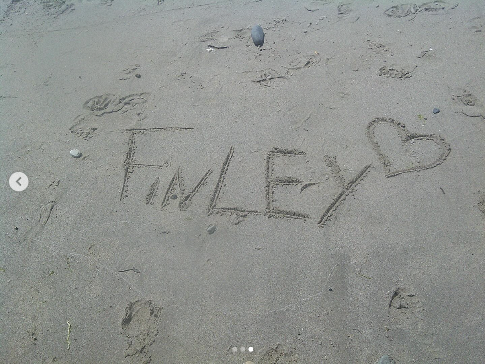Finley Lockwood's name on the sand during Malibu beach trip, dated May 2024 | Source: Instagram/finleylockwood.offical