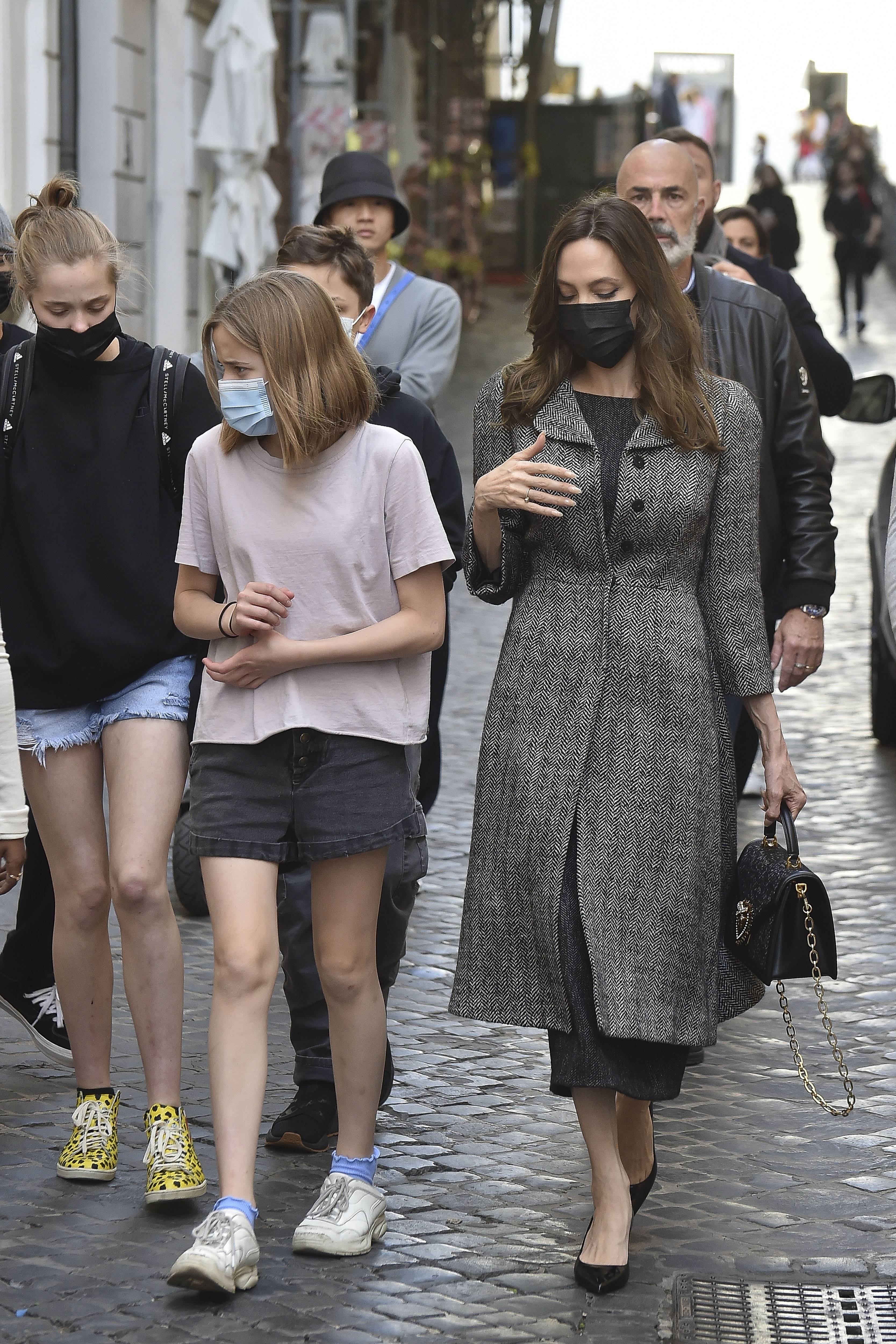 Shiloh and Vivienne Jolie-Pitt with Angelina Jolie in Rome, Italy on October 24, 2021 | Source: Getty Images