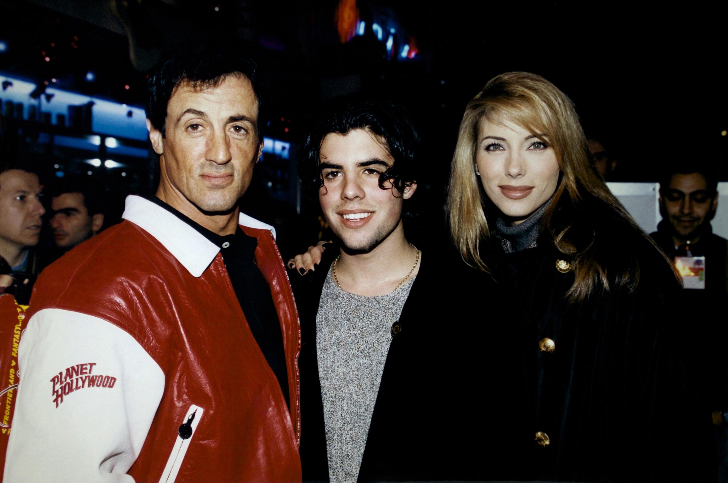 Sylvester and Sage Stallone with Jennifer Flavin during the inauguration of the Planet Hollywood restaurant on November 25, 1995, in Marne-la-Vallée, France | Source: Getty Images