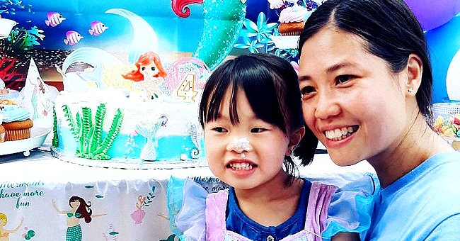 Angelina Liu sitting on her mother Pei Xia Chen Liu's lap at her mermaid-themed birthday party. | Source: twitter.com/NYPDdcer