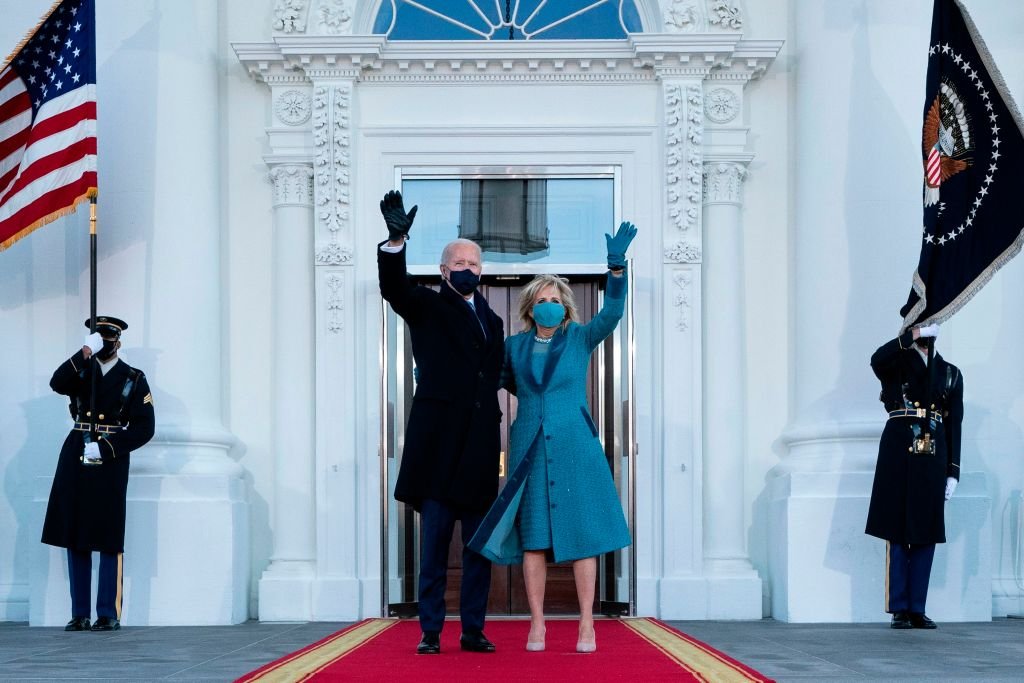 Former US President Joe Biden and First Lady Jill Biden wave as they arrive at the White House in Washington, DC, on January 20, 2021 | Source: Getty Images