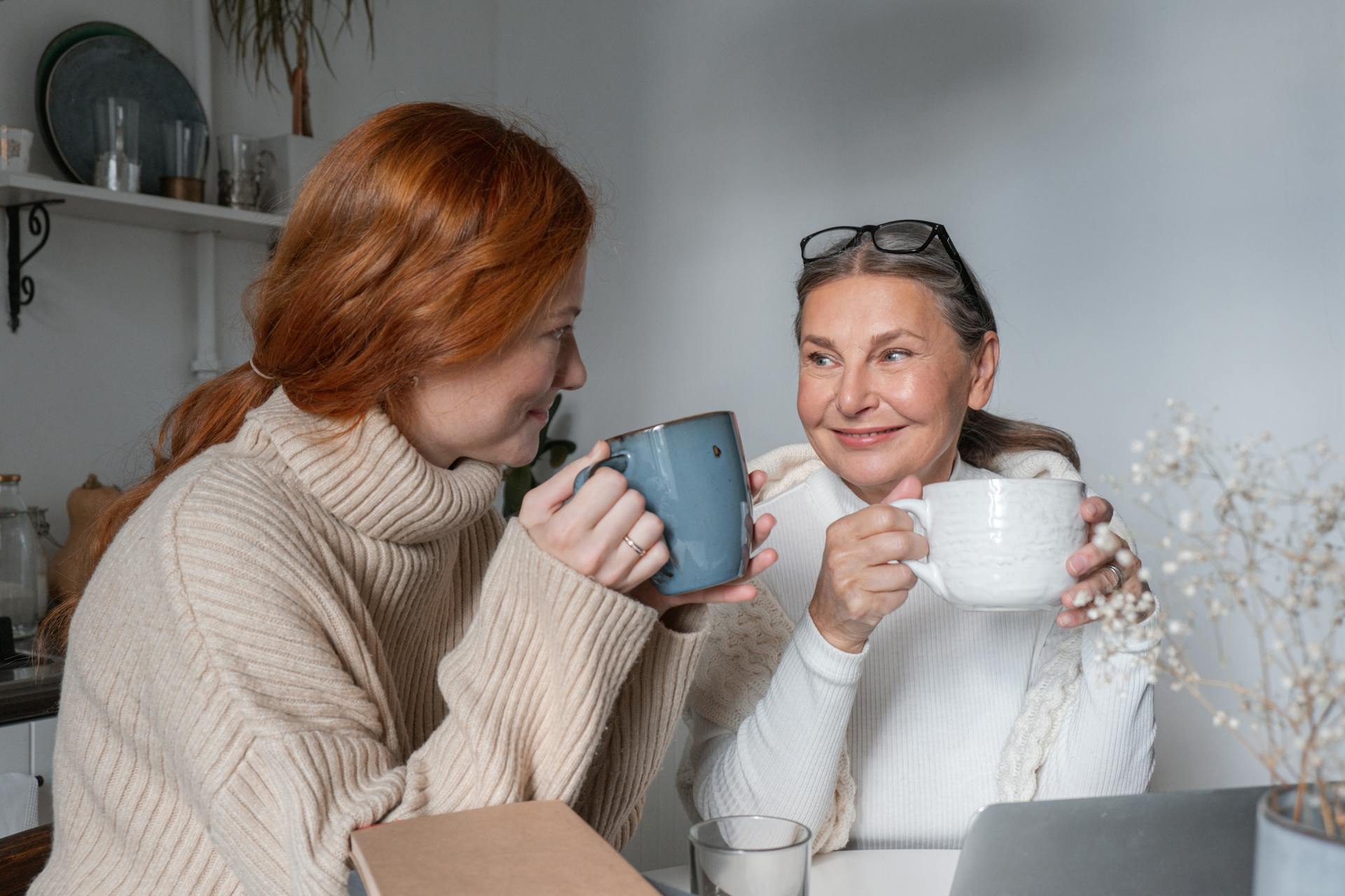 Two people smiling and drinking tea | Source: Pexels