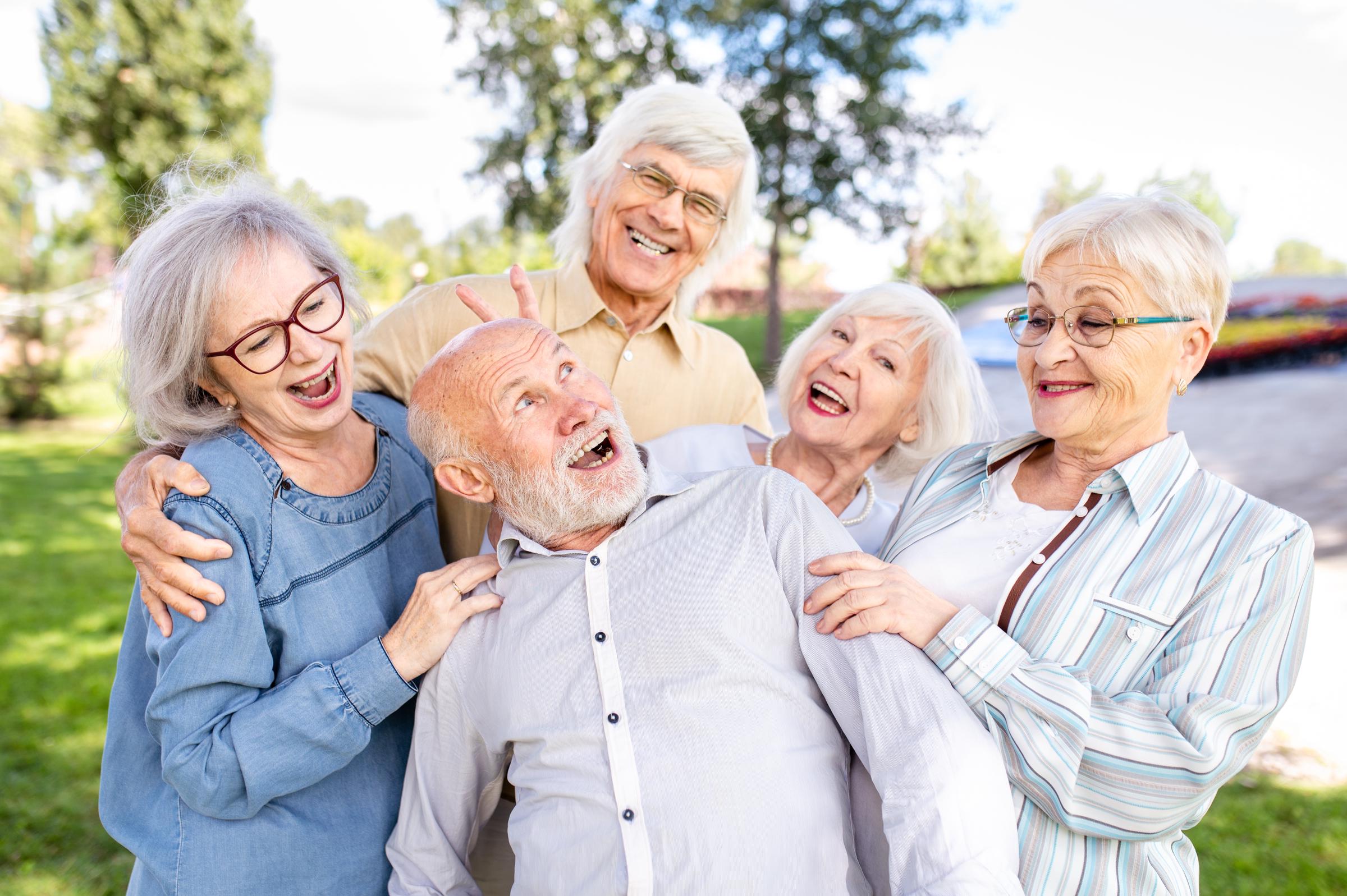 A group of happy elderly people | Source: Shutterstock
