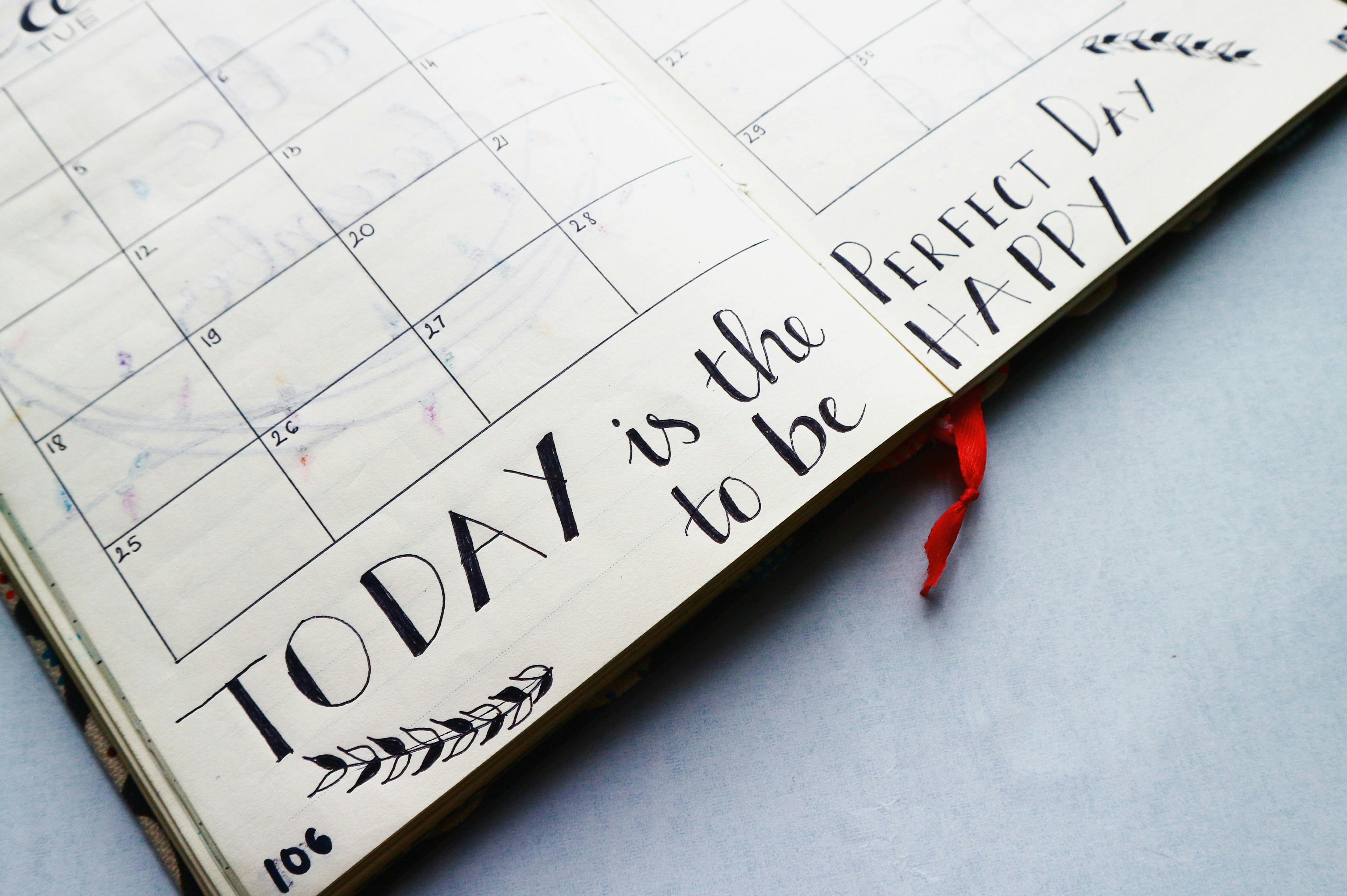 A calendar laid out on a desk | Source: Pexels