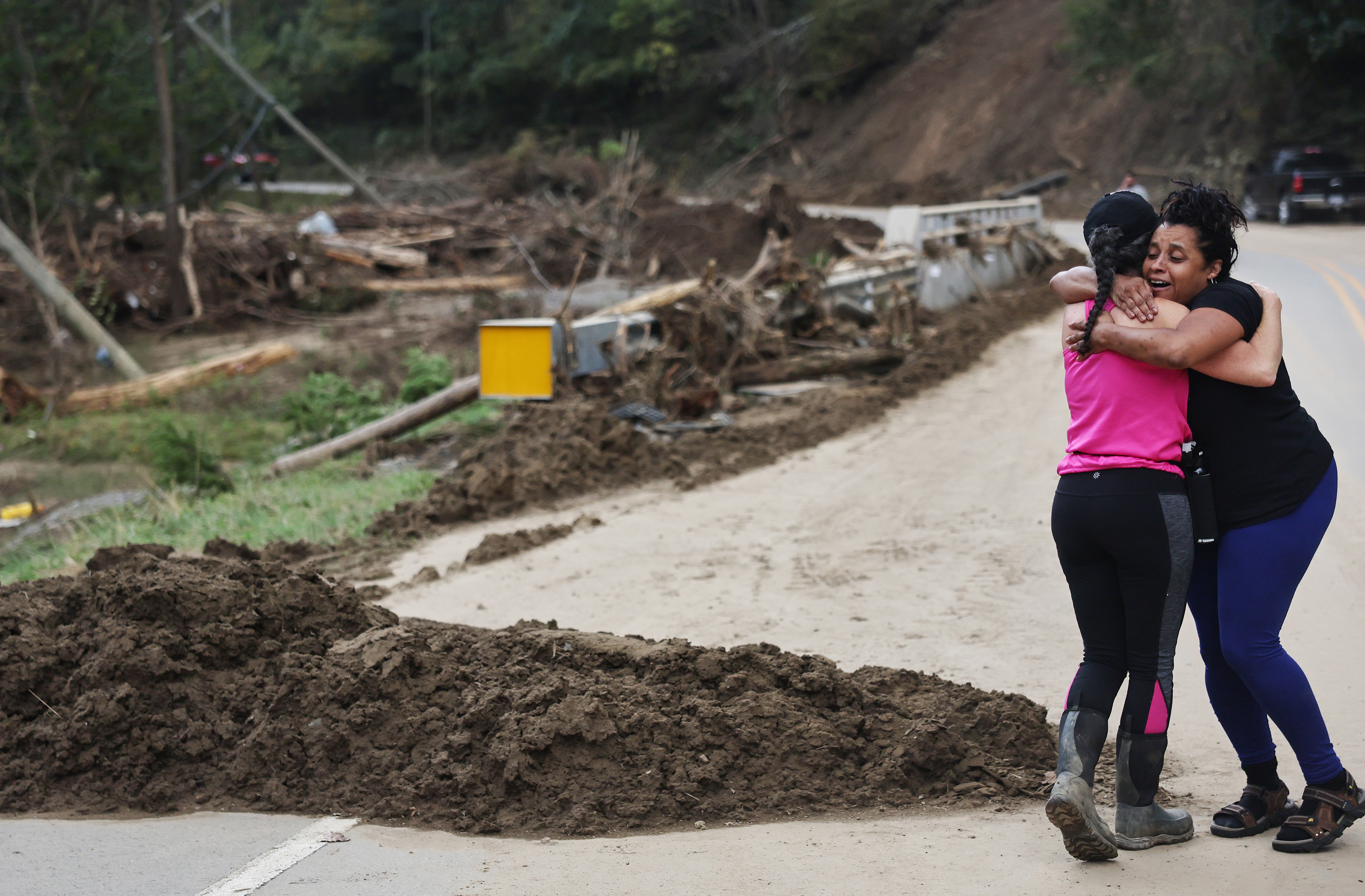 Tammie Mance hugs her boss Liesl Steiner, whose home was destroyed by Hurricane Helene in Black Mountain, North Carolina, on October 3, 2024 | Source: Getty Images