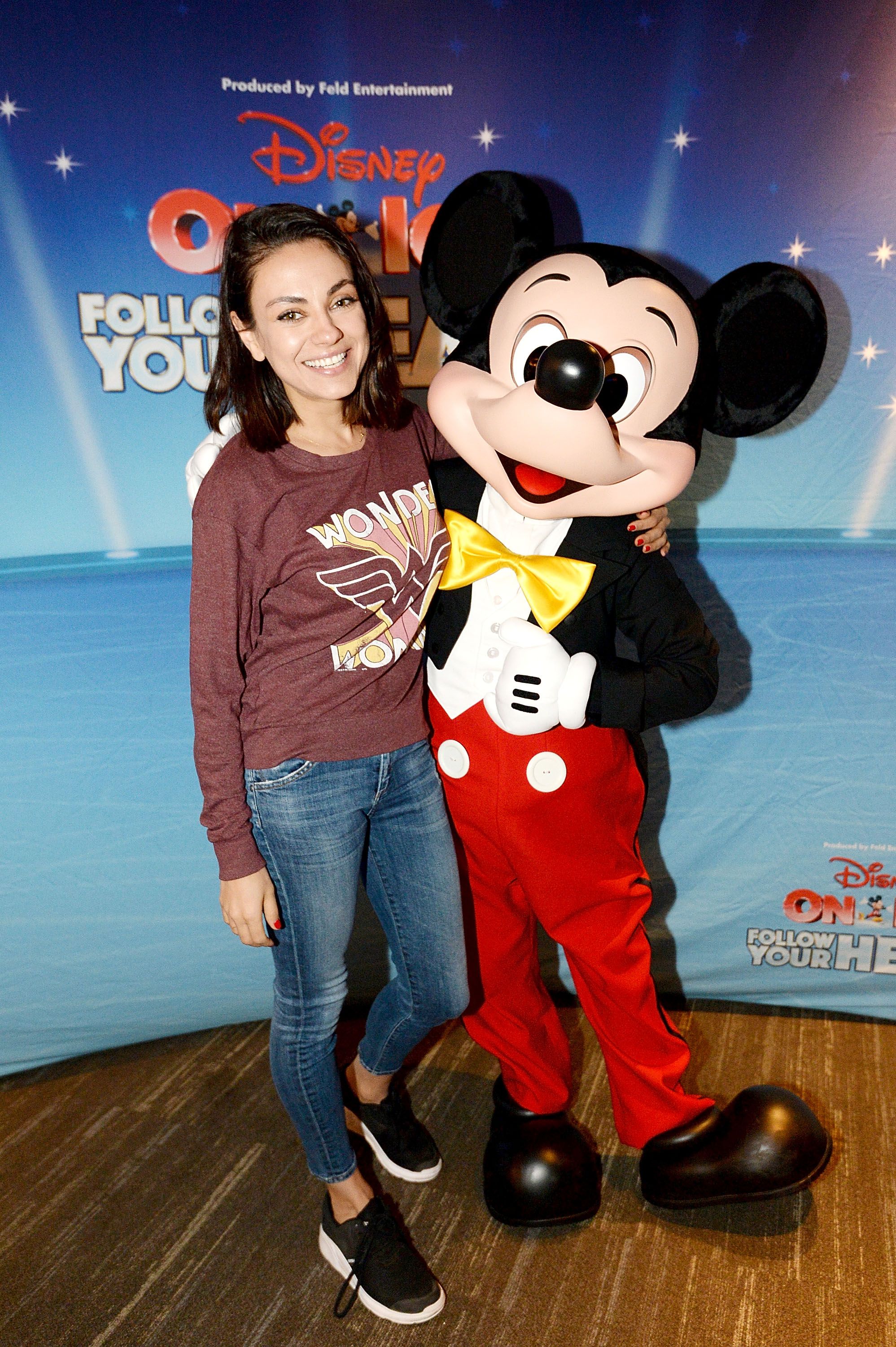Mila Kunis and Mickey Mouse at Disney On Ice: Follow Your Heart on December 16, 2017, in Los Angeles, California. | Source: Andrew D. Bernstein/Getty Images