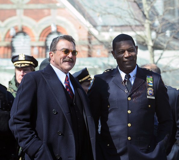 Actors Tom Selleck and Dennis Haysbert on the set of "Blue Bloods" on March 23, 2015 in New York City | Photo: Getty Images