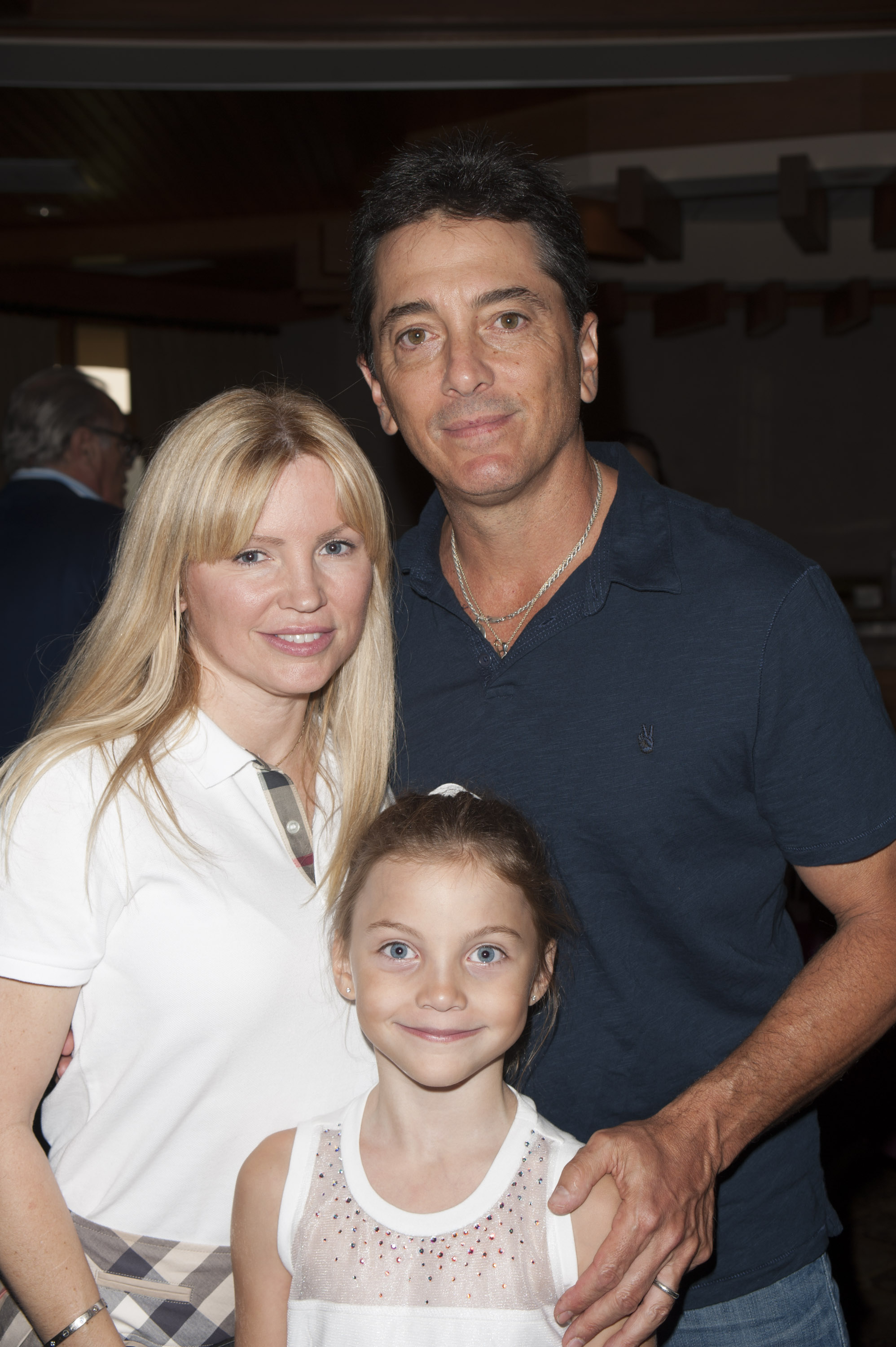 The famous actor with his wife and daughter at an annual charity golf tournament on September 21, 2015, in Woodland Hills, California. | Source: Getty Images