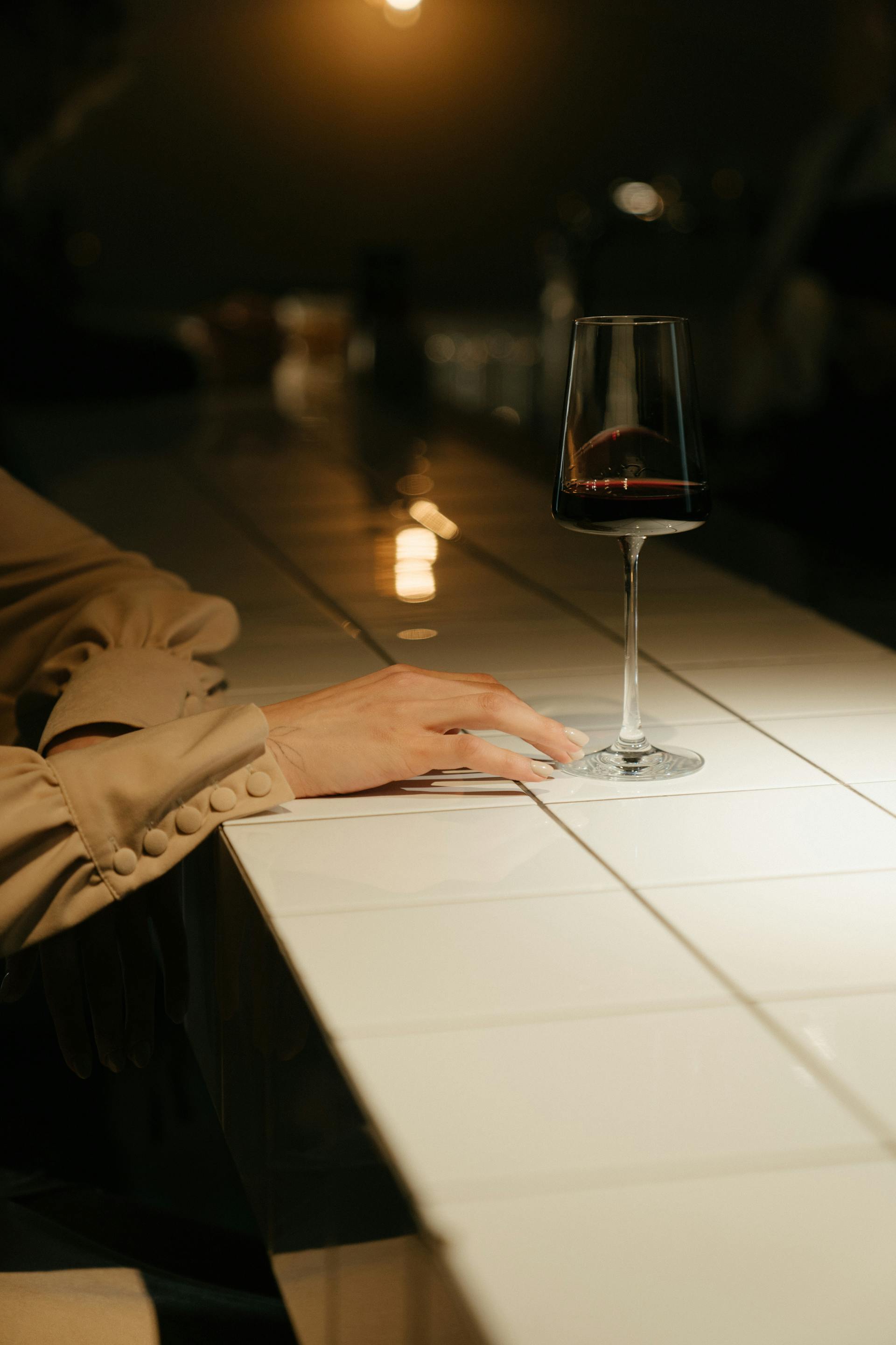 Woman with a glass of wine | Source: Pexels