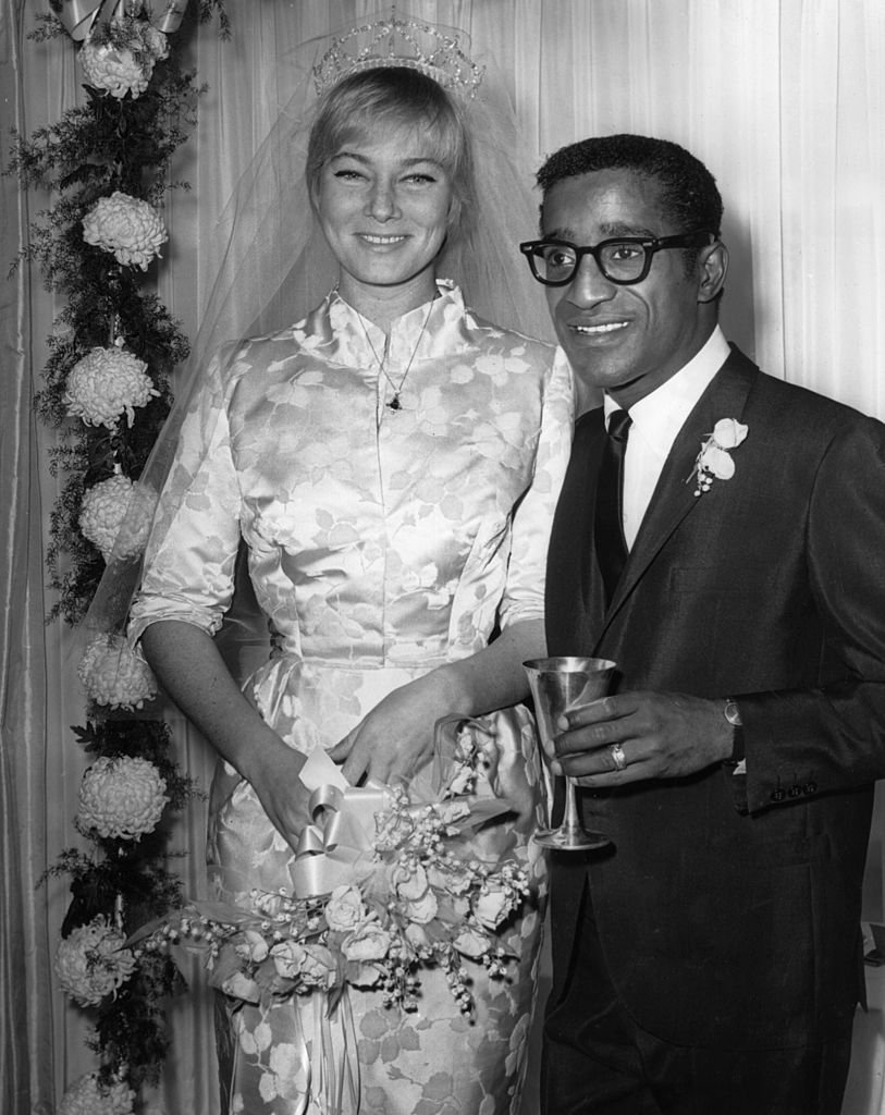 May Britt and Sammy Davis Jr. at their wedding reception at Davis's home, Hollywood | Photo: Getty Images