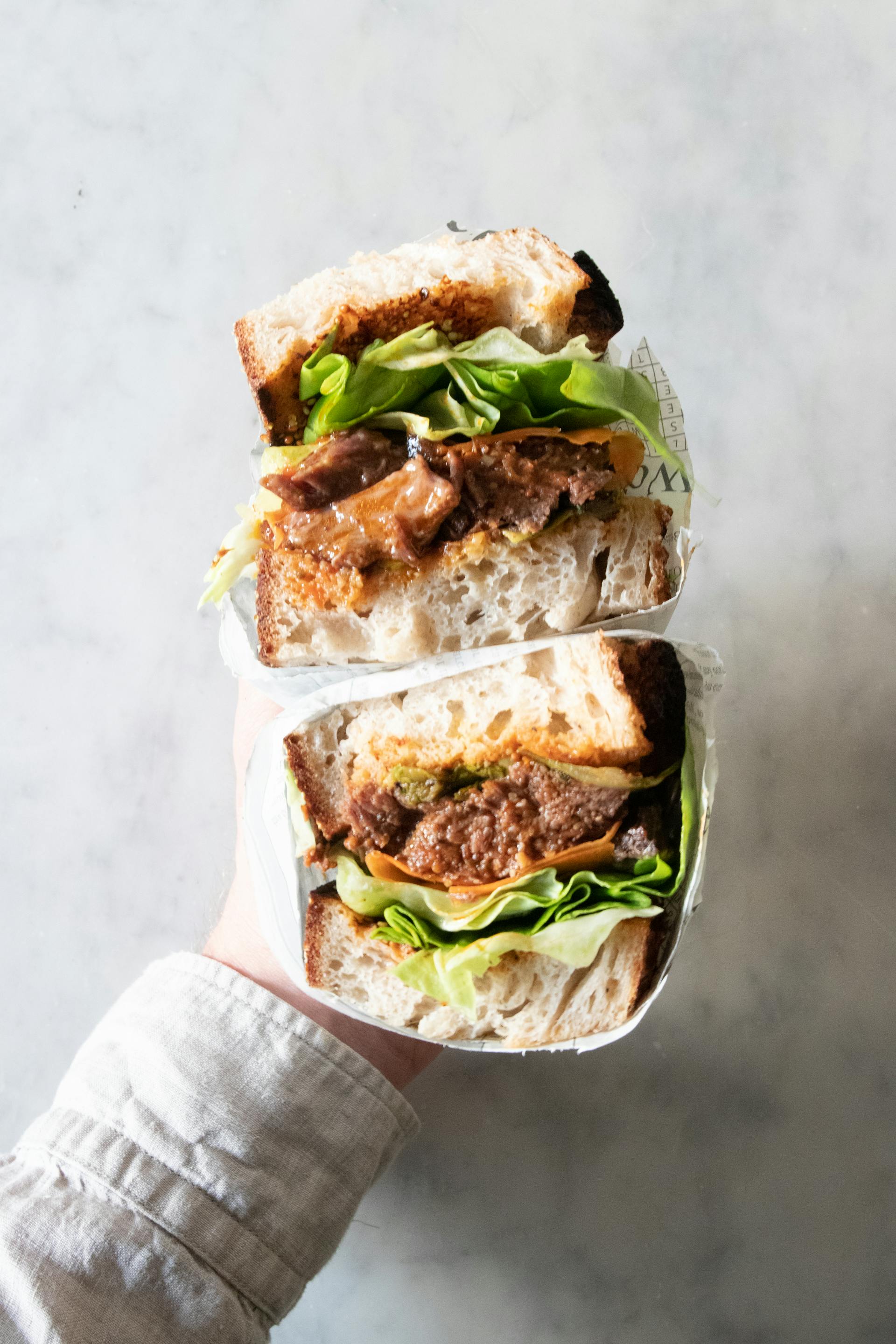 A person holding a sub sandwich | Source: Pexels