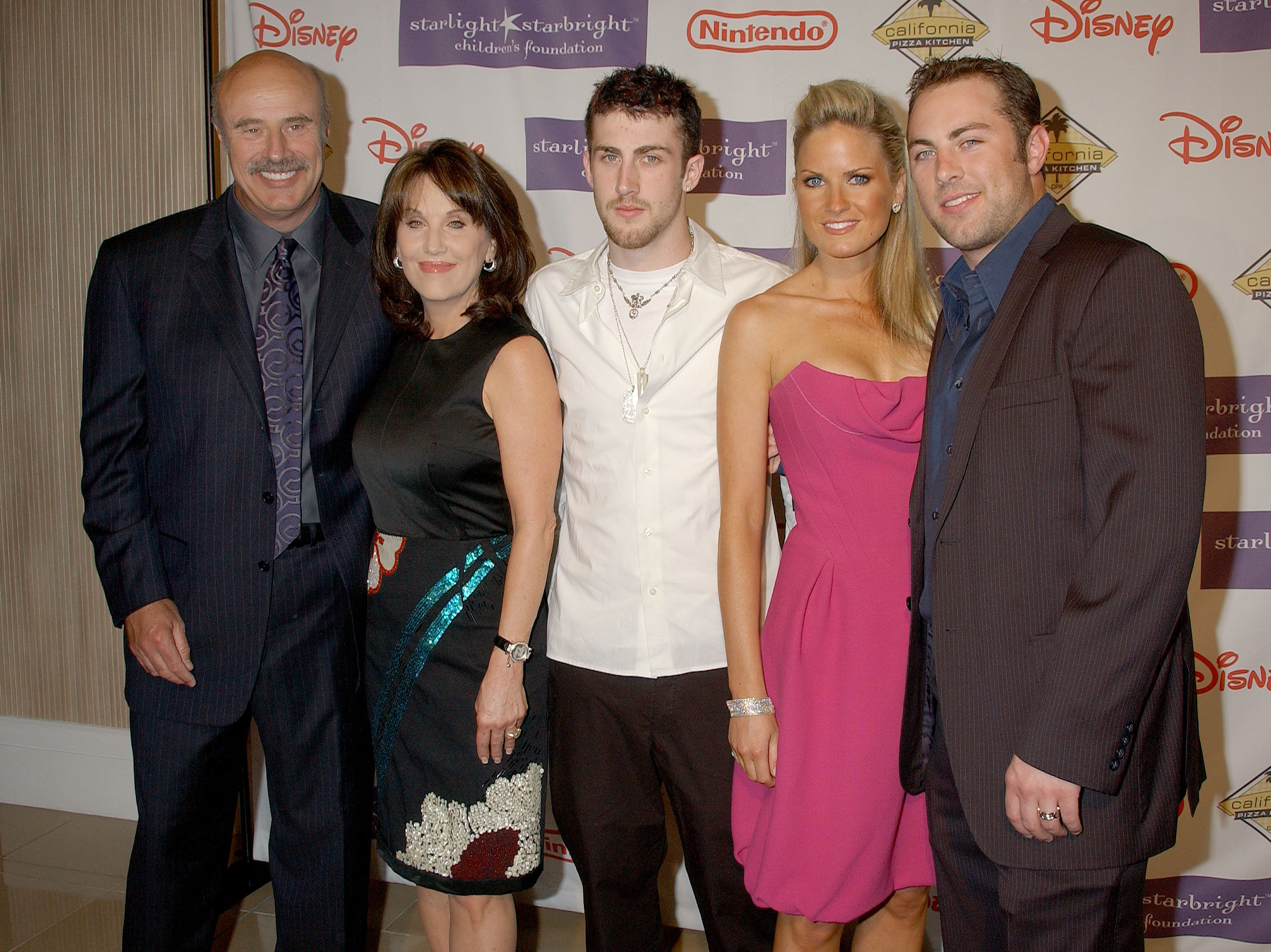 Dr. Phil McGraw, Robin McGraw, their sons, Jordan McGraw, and Jay McGraw, and  Erica Dahm. | Source: Getty Images