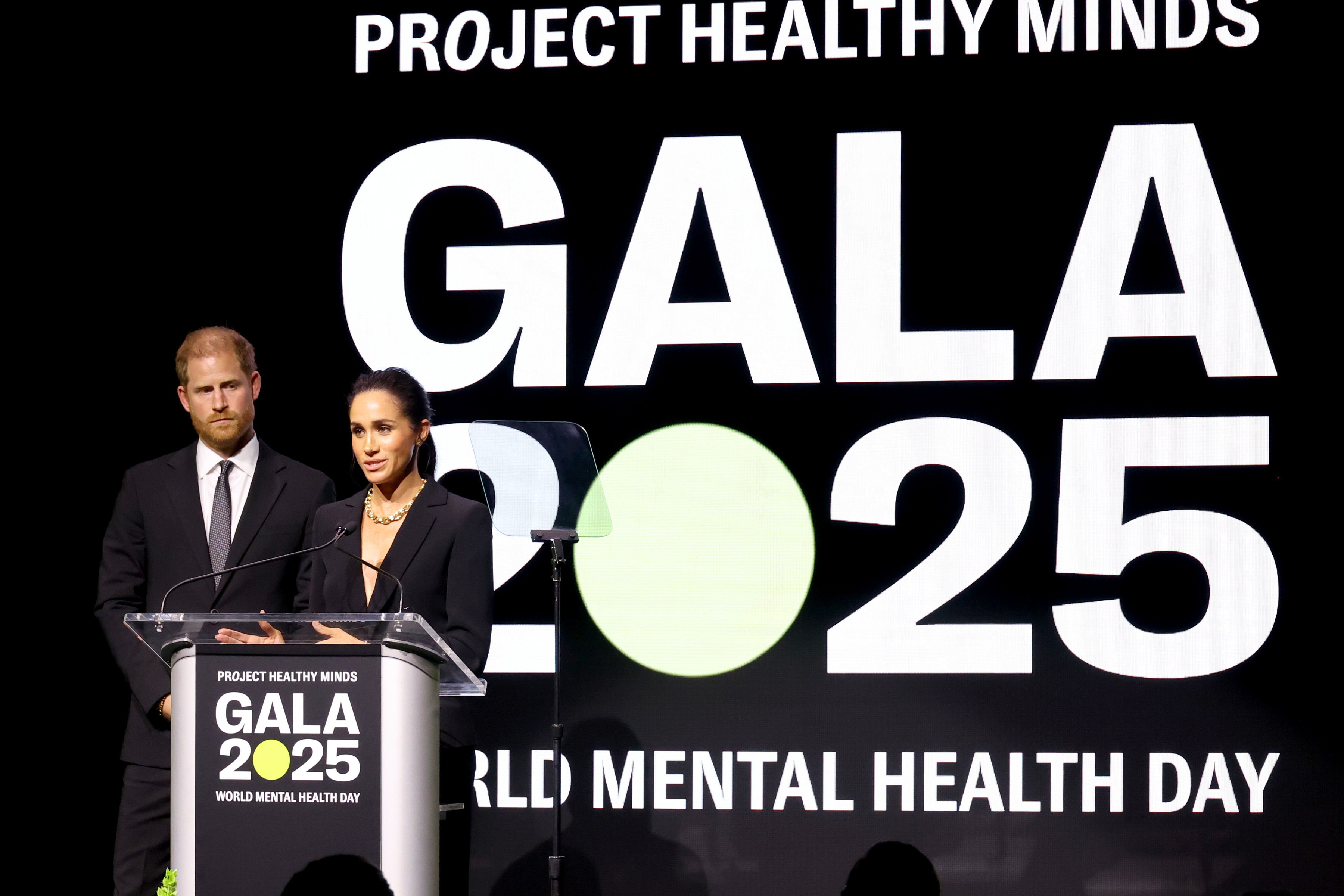 Meghan Markle and Prince Harry speak onstage the Project Healthy Minds World Mental Health Day Gala in New York City  on October 9, 2025 | Source: Getty Images