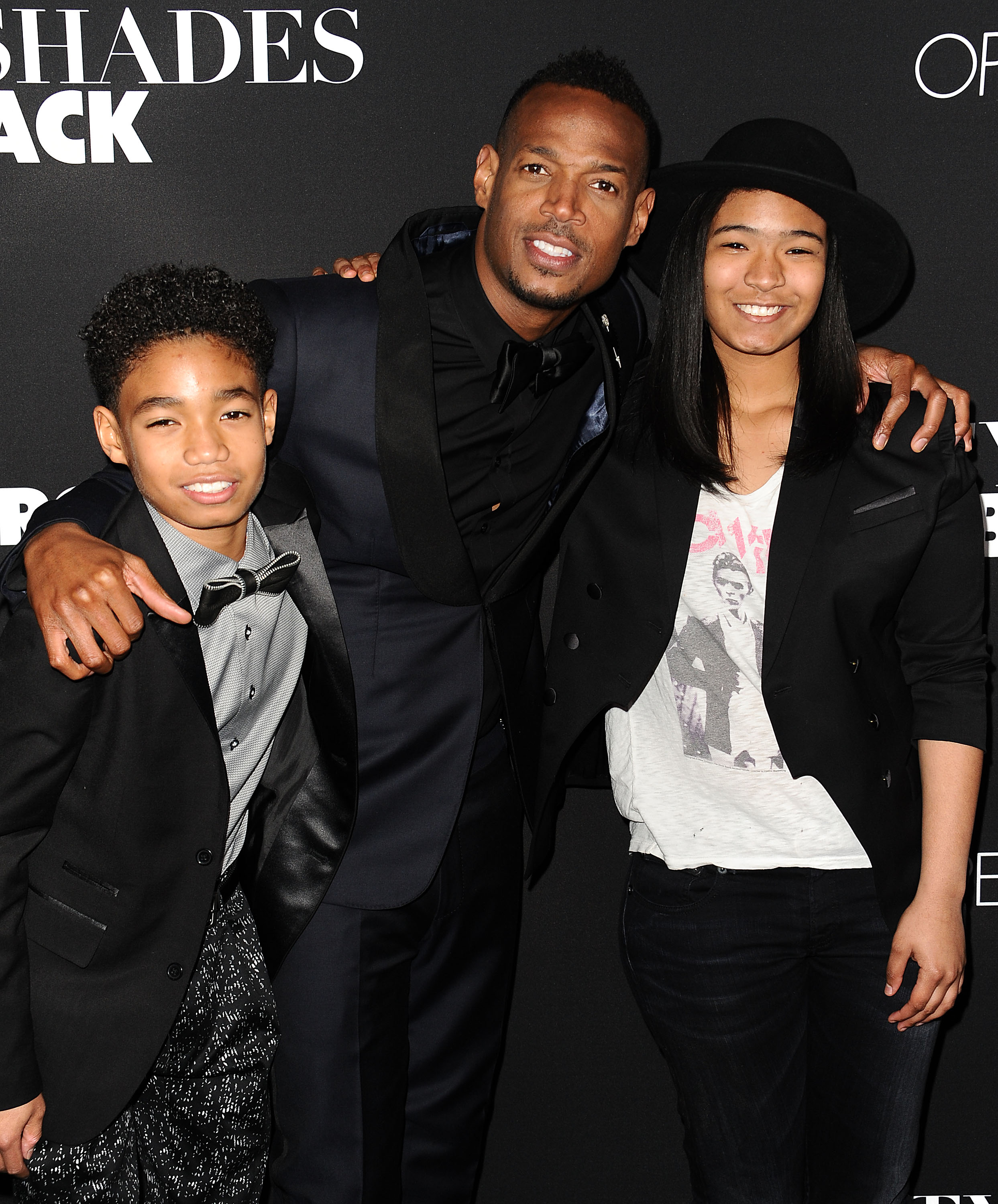 Marlon Wayans and children Shawn Howell and Amai Zackary attend the premiere of "Fifty Shades of Black" on January 26, 2016 | Source: Getty Images
