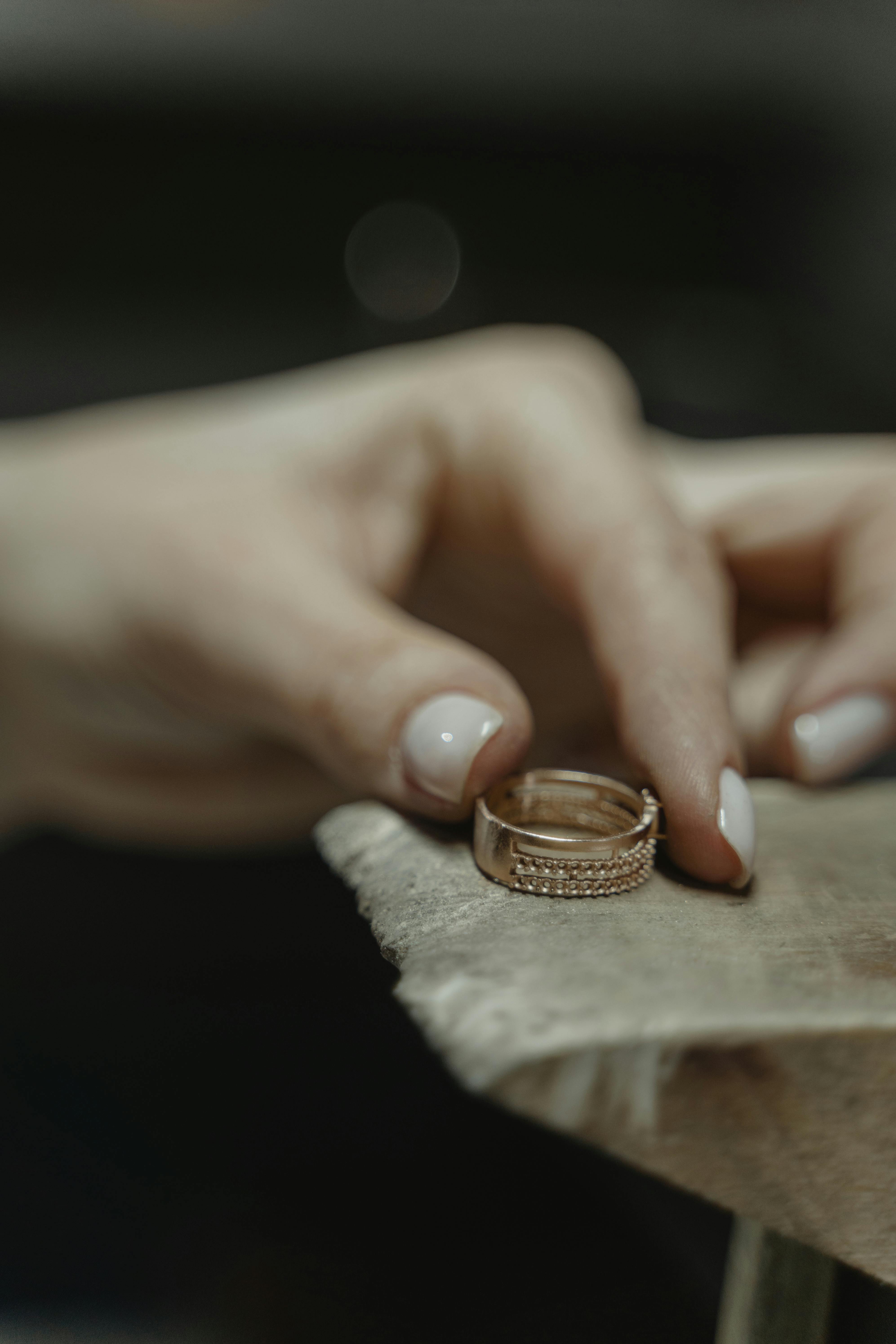 Woman's hand holding a ring | Source: Pexels