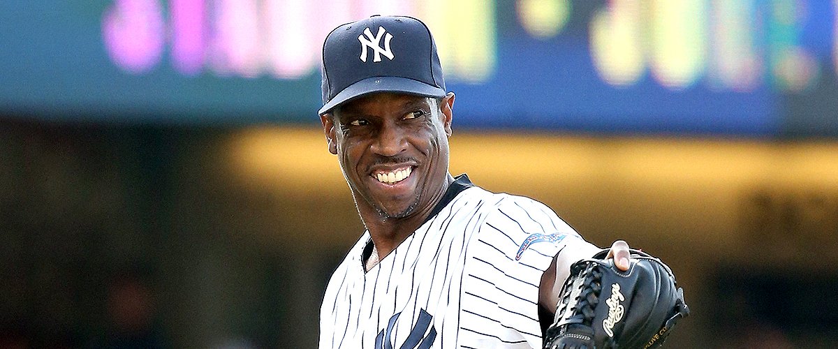 Dwight Gooden smiles and points as he pitches against the Los Angeles Dodgers in an Old Timers game before the game betweenthe Atlanta Braves and the Los Angeles Dodgers at Dodger Stadium on June 8, 2013 | Photo: Getty Images