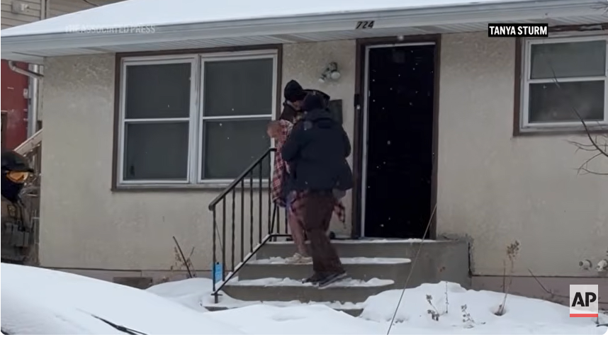 ICE agents lead ChongLy "Scott" Thao out of his house, from a post dated January 20, 2026 | Source: Youtube/AssociatedPress