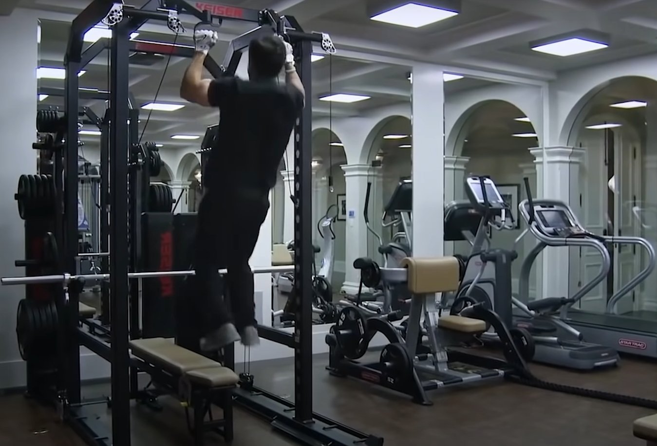 Pictured: Actor Mark Wahlberg working out in his fully equipped gym in his French Manor | Source: YouTube/@MensHealth