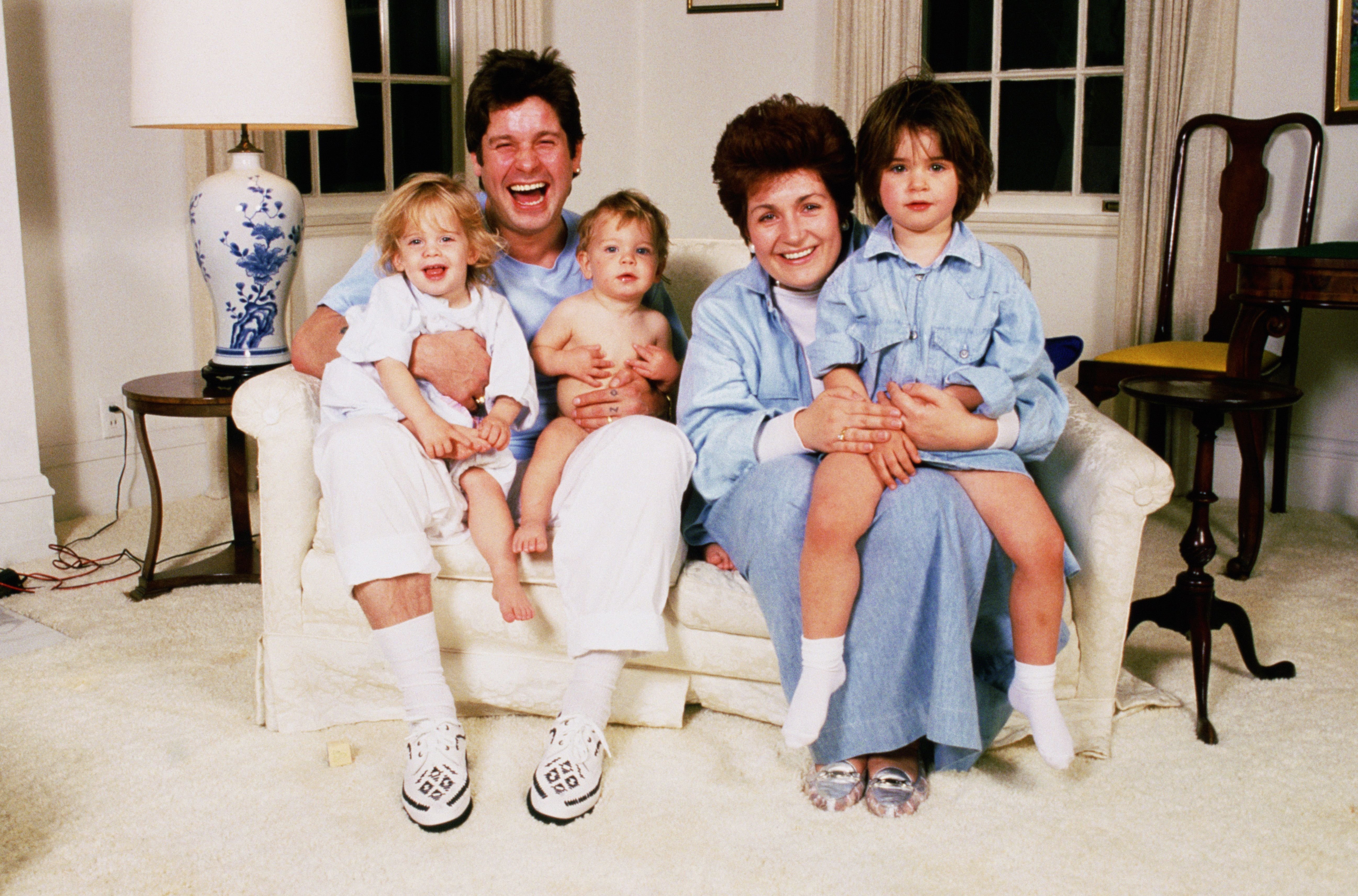 Ozzy and Sharon Osbourne at home with their children in early the 1990s | Source: Getty Images