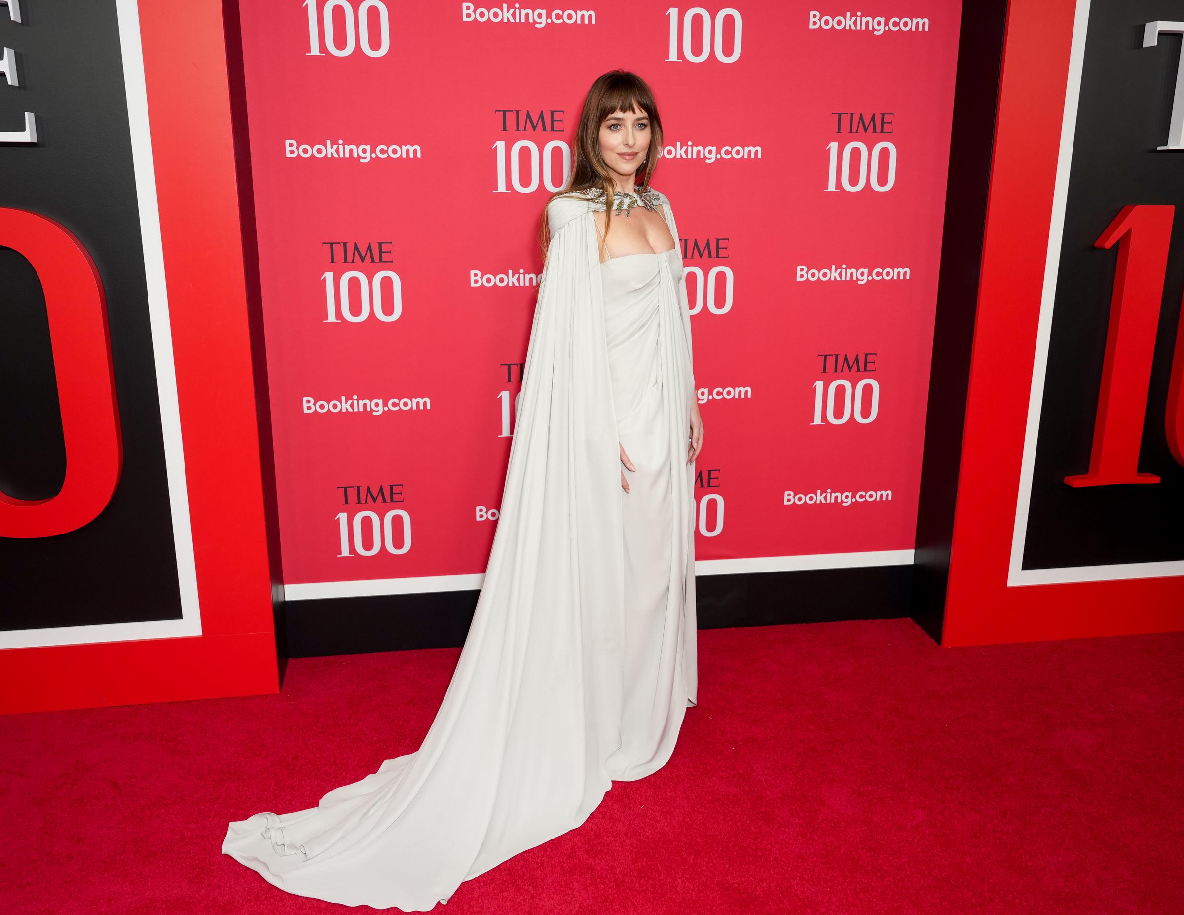 Dakota Johnson posing for photos at the event. | Source: Getty Images