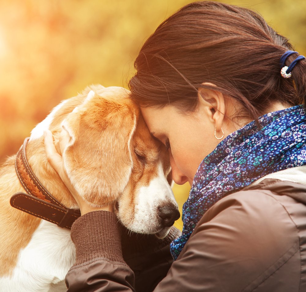 A woman with her dog. | Photo: Shutterstock