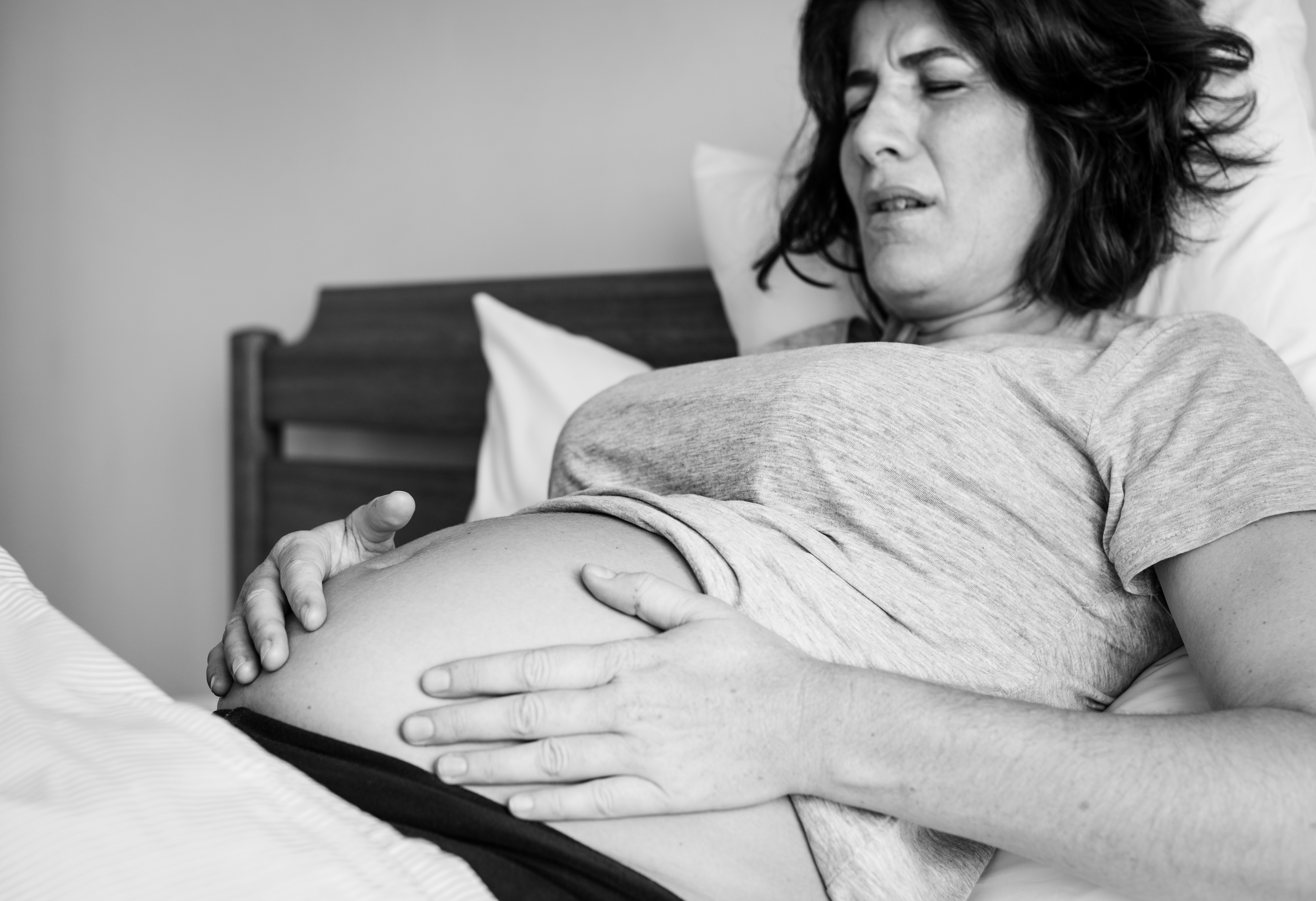 Woman in pain after birth | Source: Freepik